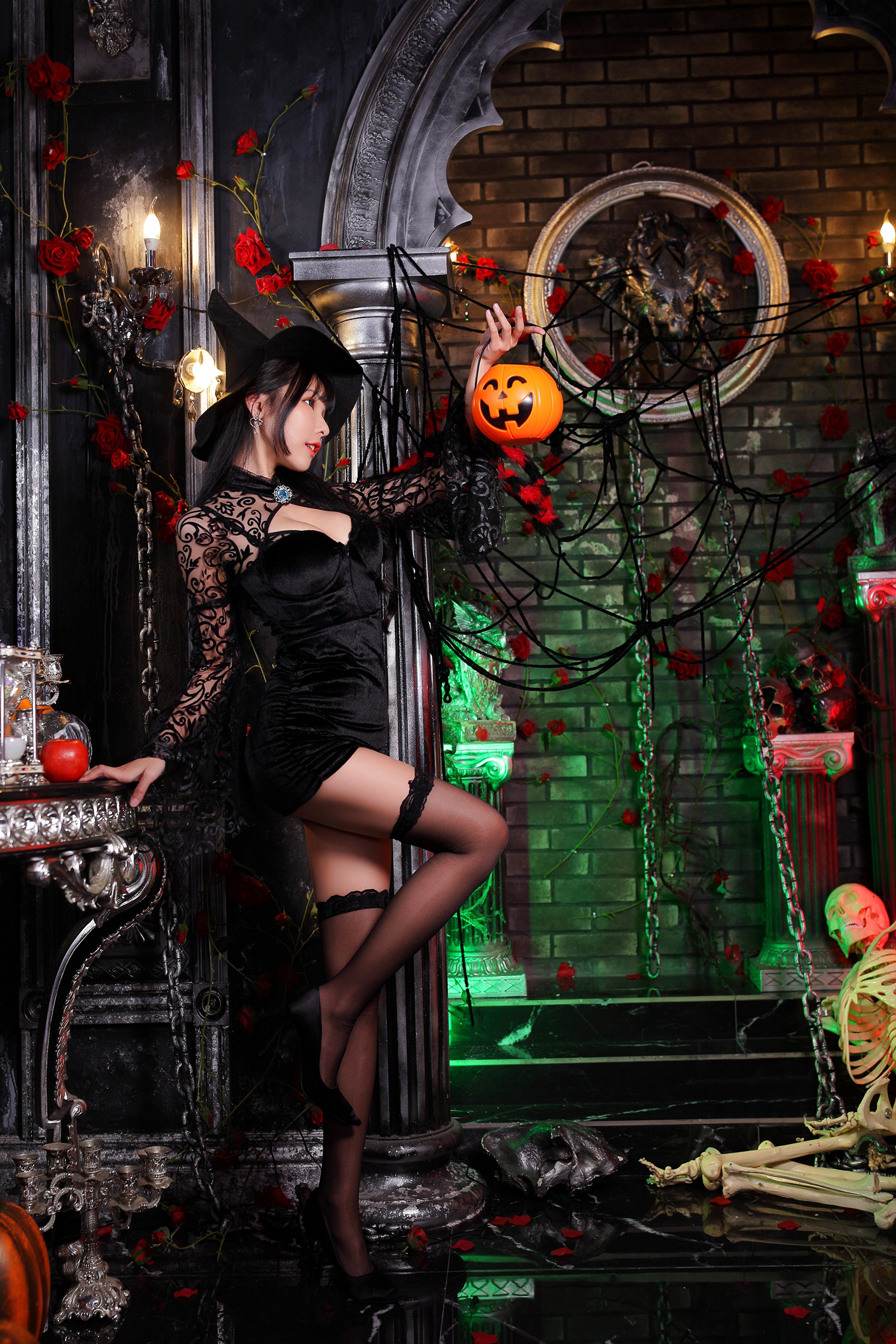 Asian Witch with Pumpkin Lantern and Skeleton Decor HD Phone Wallpaper