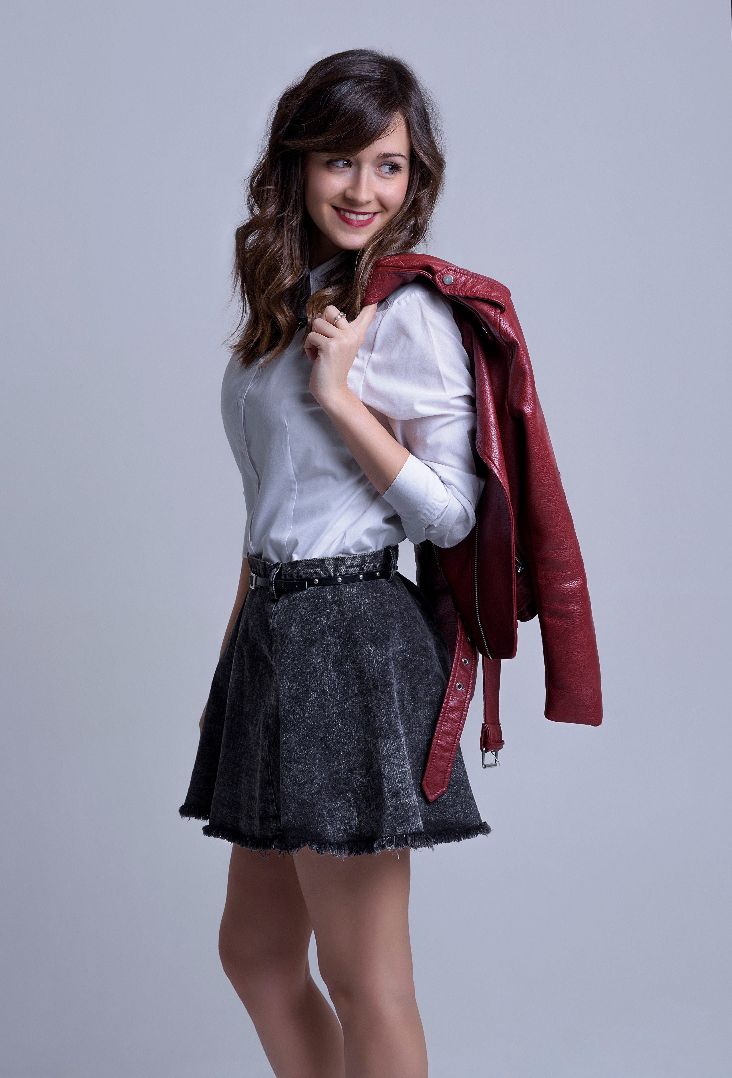 Woman in white blouse, gray skirt, and red jacket HD Phone Wallpaper