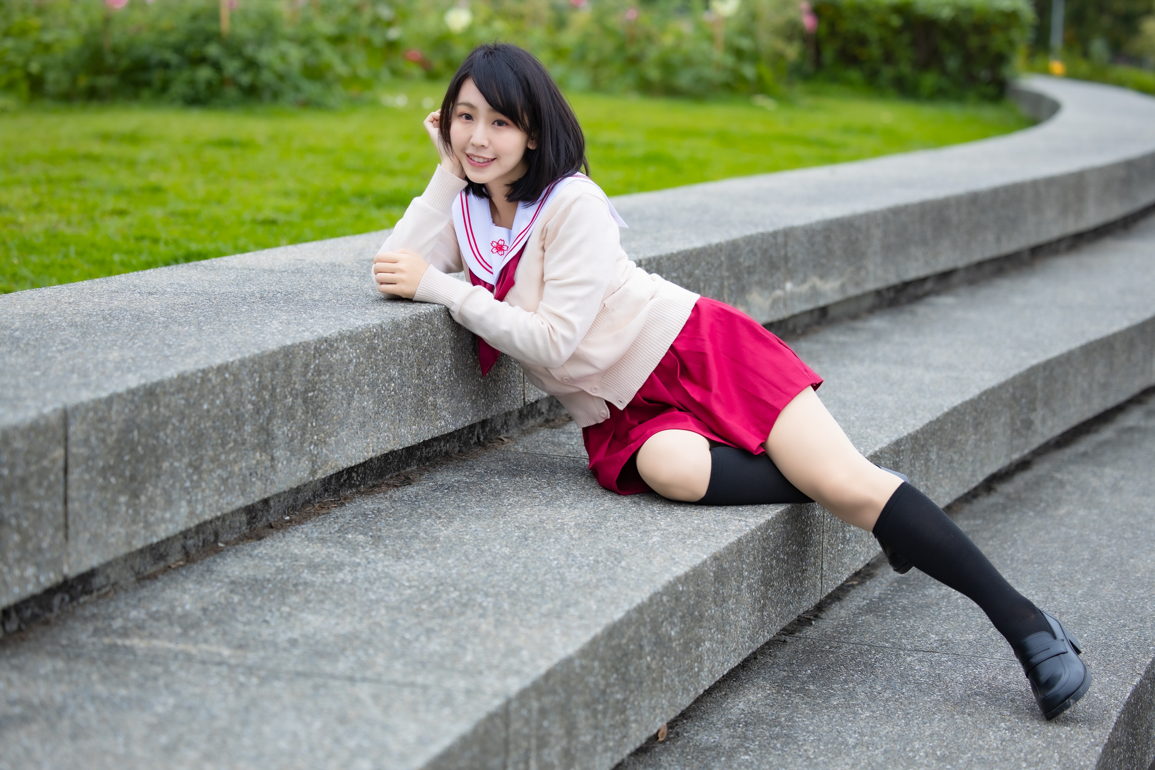 Brunette girl in school uniform on stairs HD Wallpaper