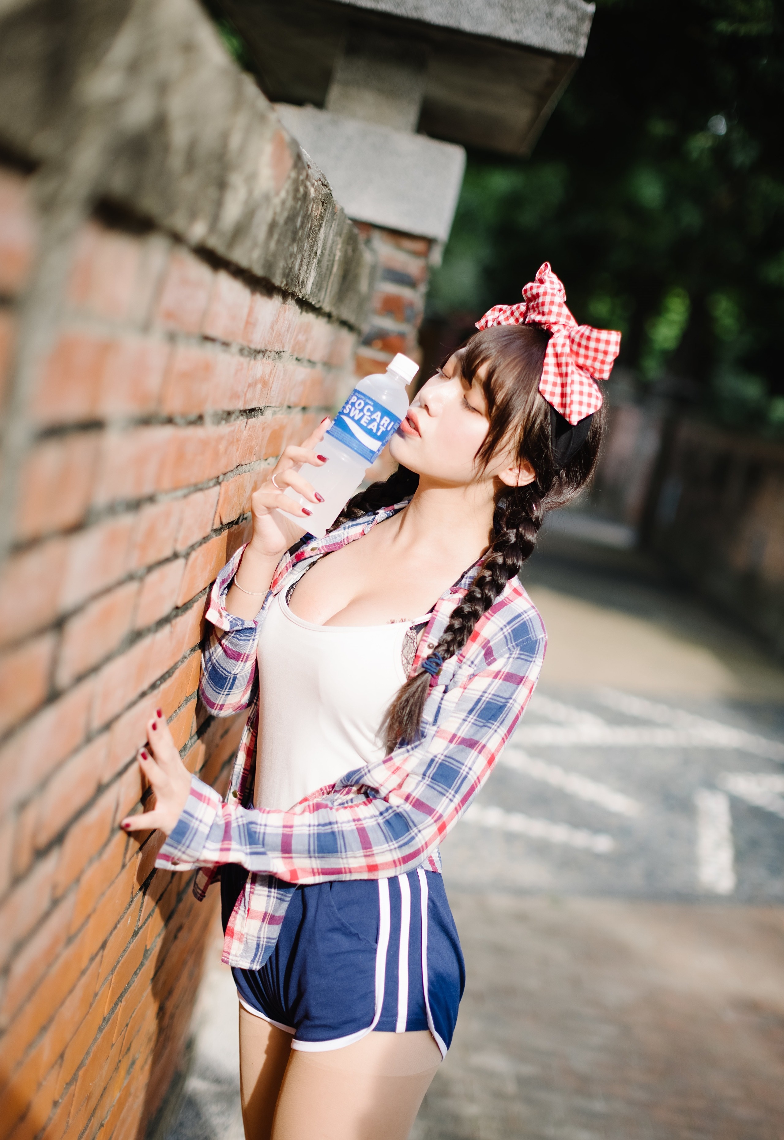 Brunette girl with red bowknot drinking Pocari Sweat HD Phone Wallpaper