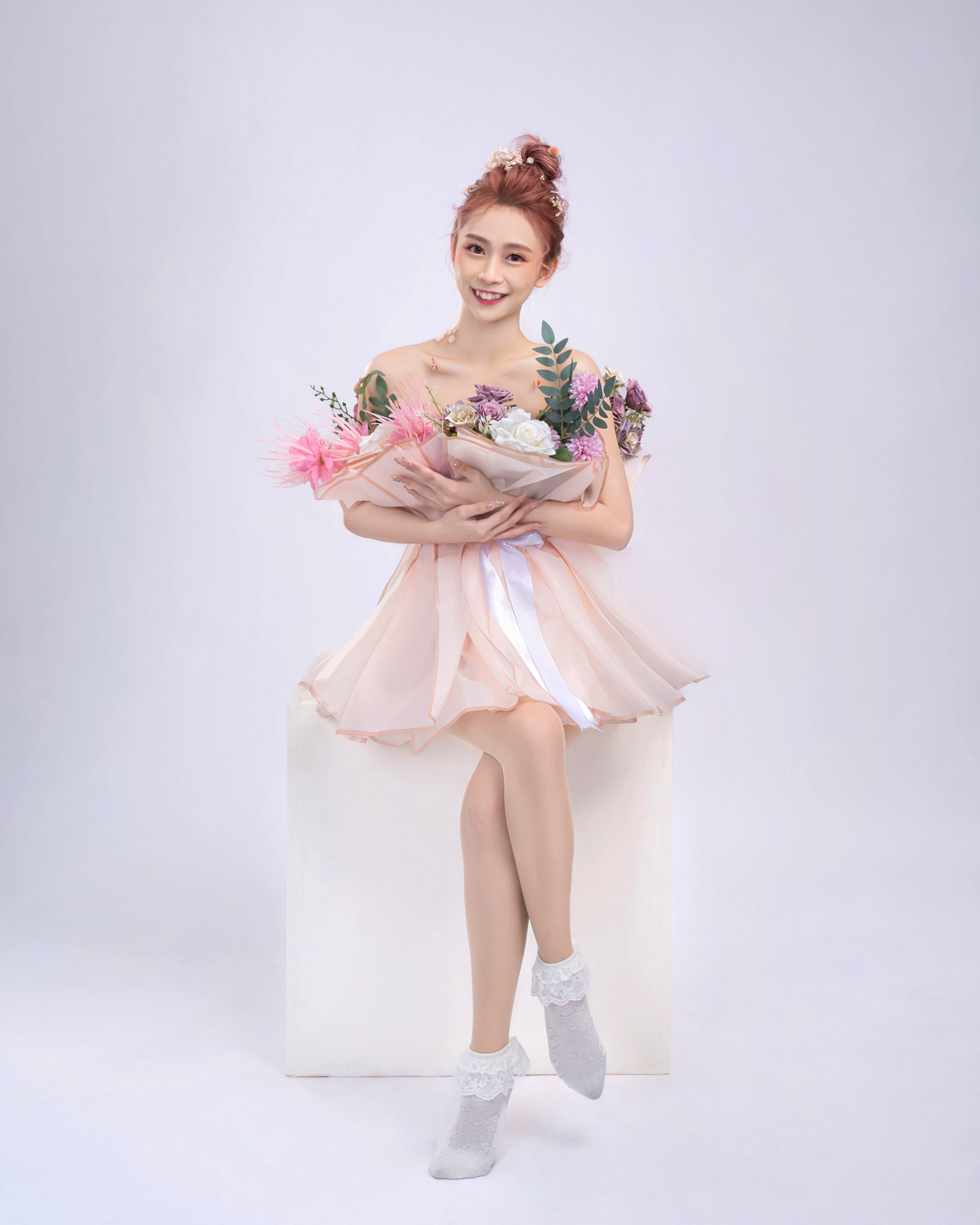 Asian woman in pink dress holding flowers HD Phone Wallpaper