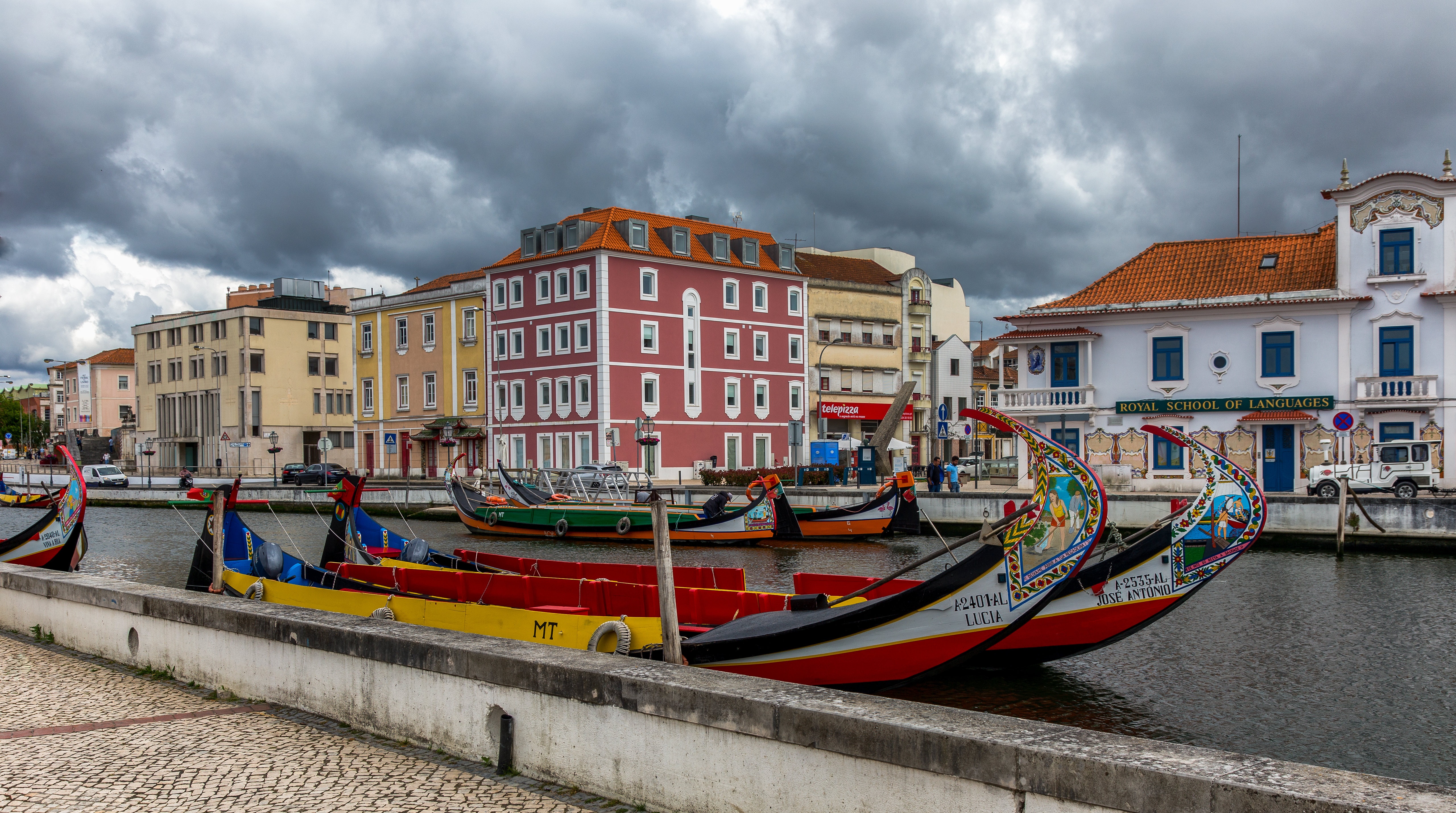 Moliceiro boats on a canal in Aveiro, Portugal HD Wallpaper