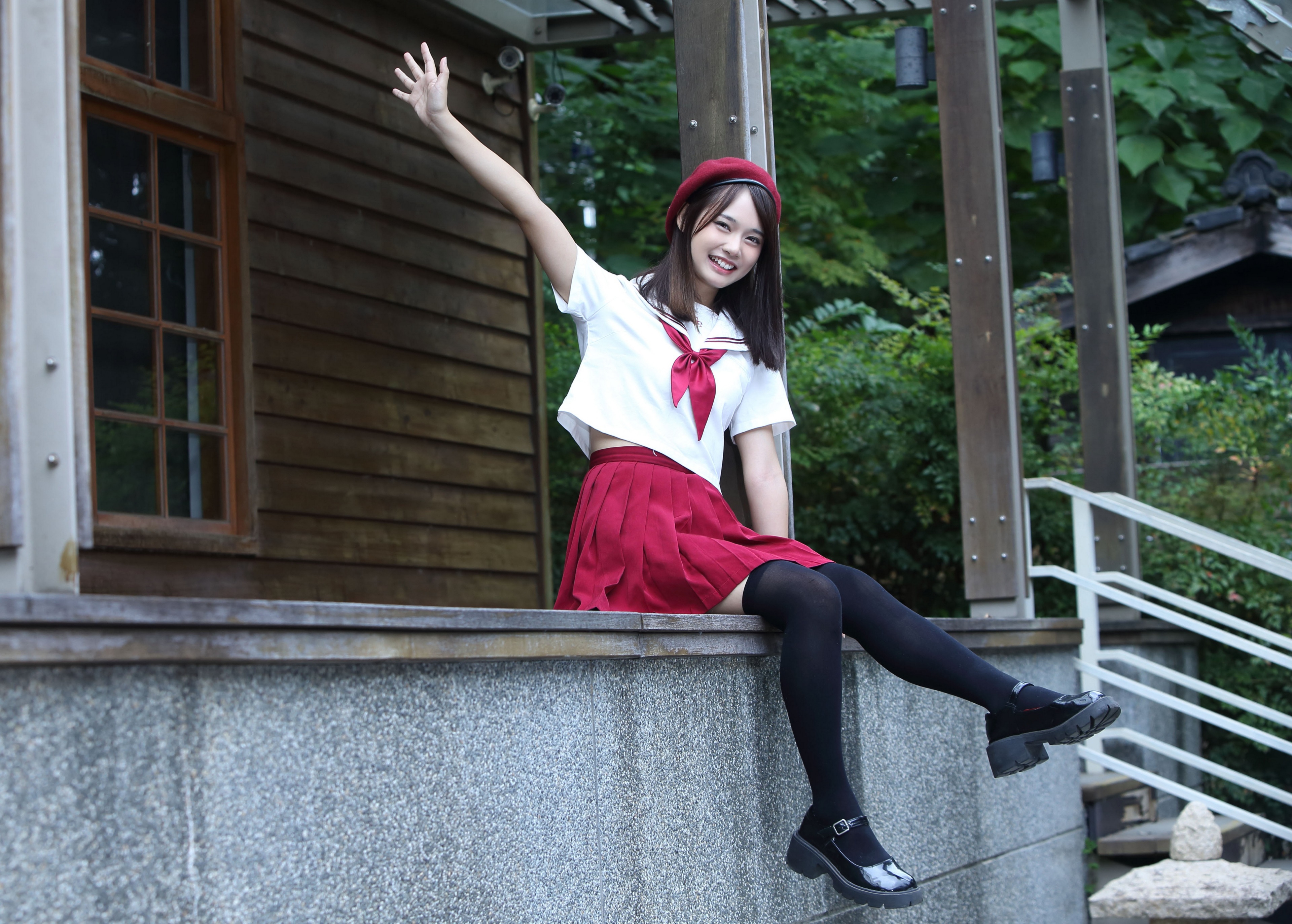 Asian girl in sailor uniform and beret waving HD Wallpaper