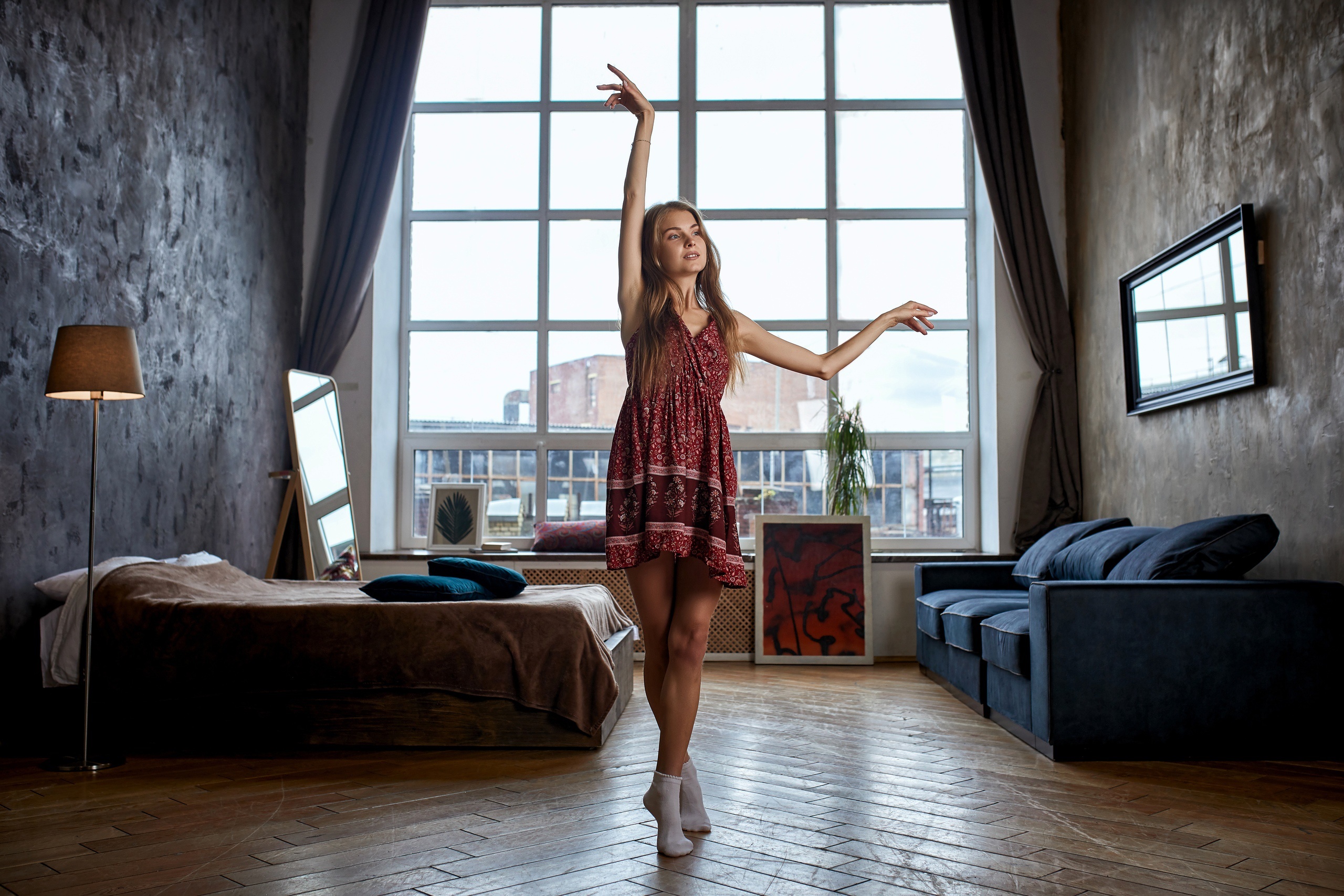 Woman in dress dancing in a loft apartment HD Wallpaper