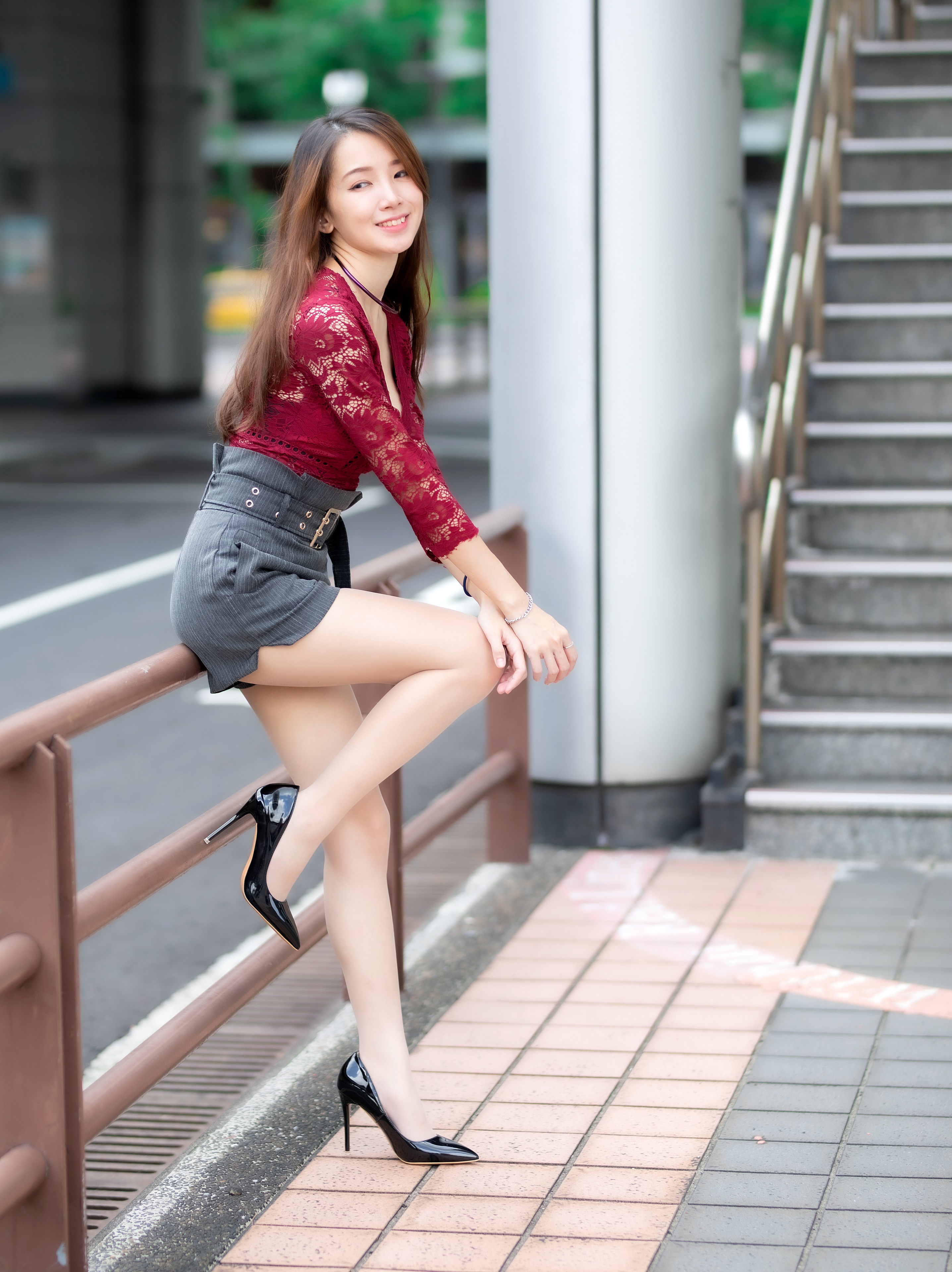 Asian woman in shorts and stilettos posing HD Phone Wallpaper
