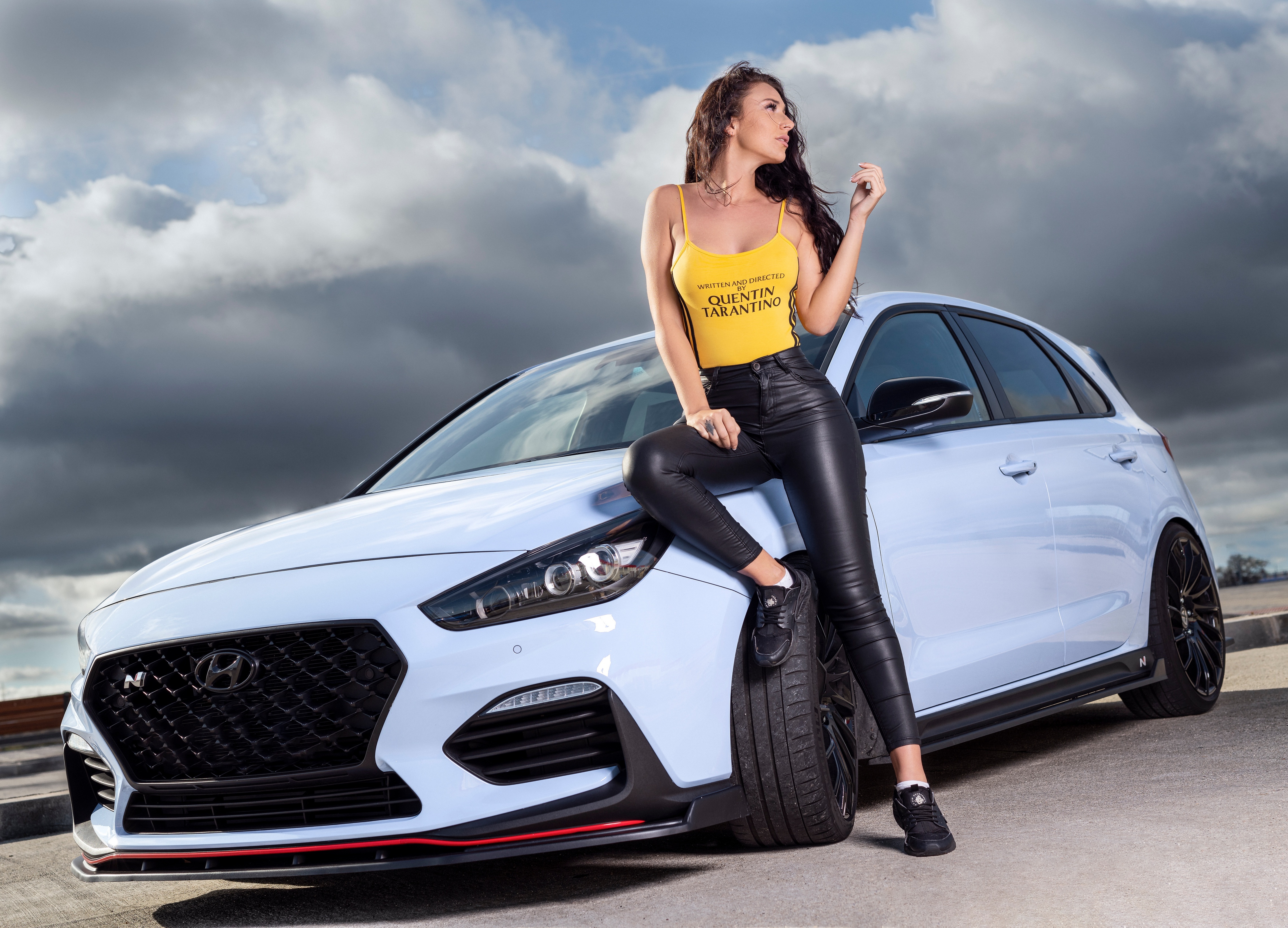 Ana Lopez posing with a white Hyundai HD Wallpaper