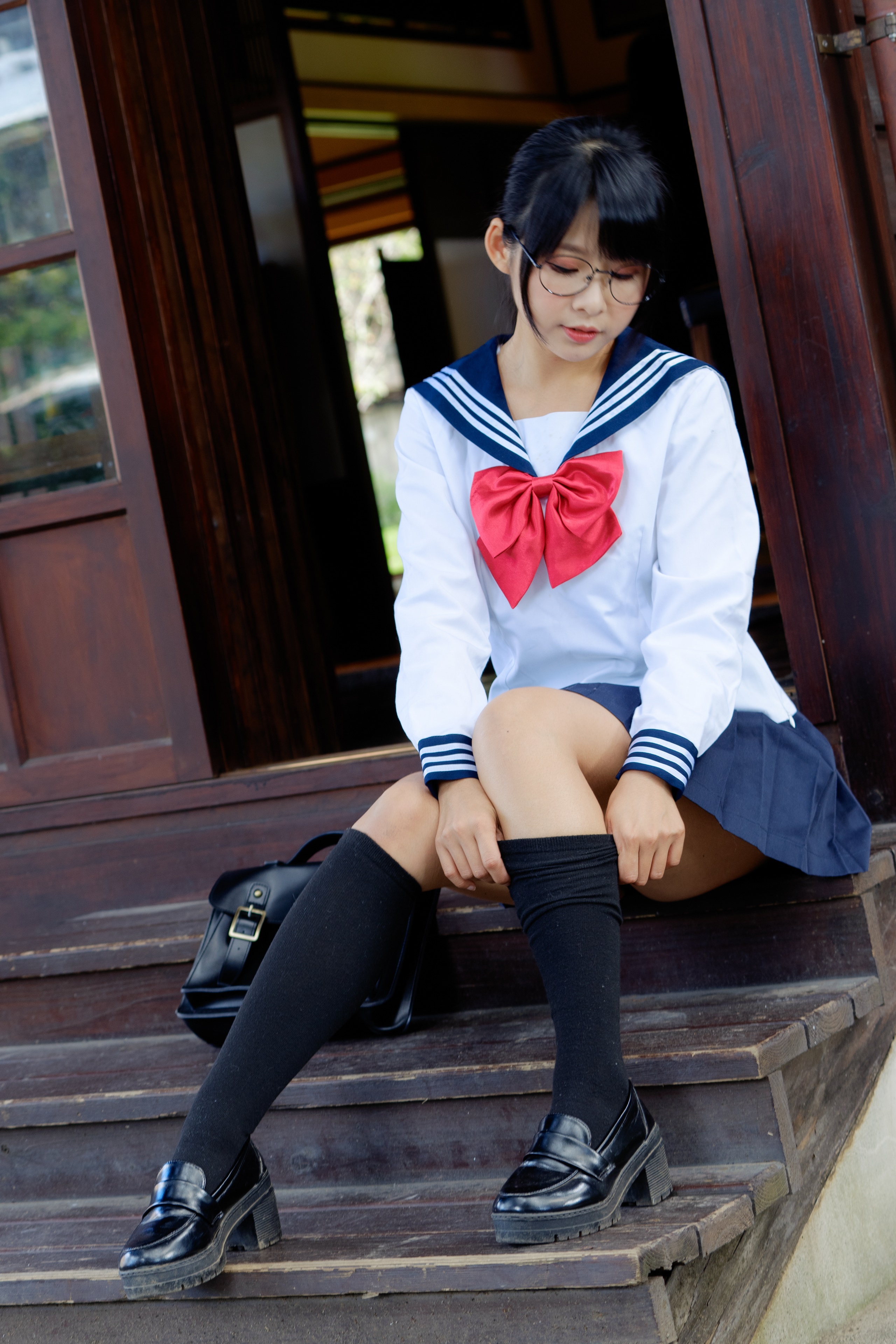 Asian girl in school uniform sitting on stairs HD Phone Wallpaper