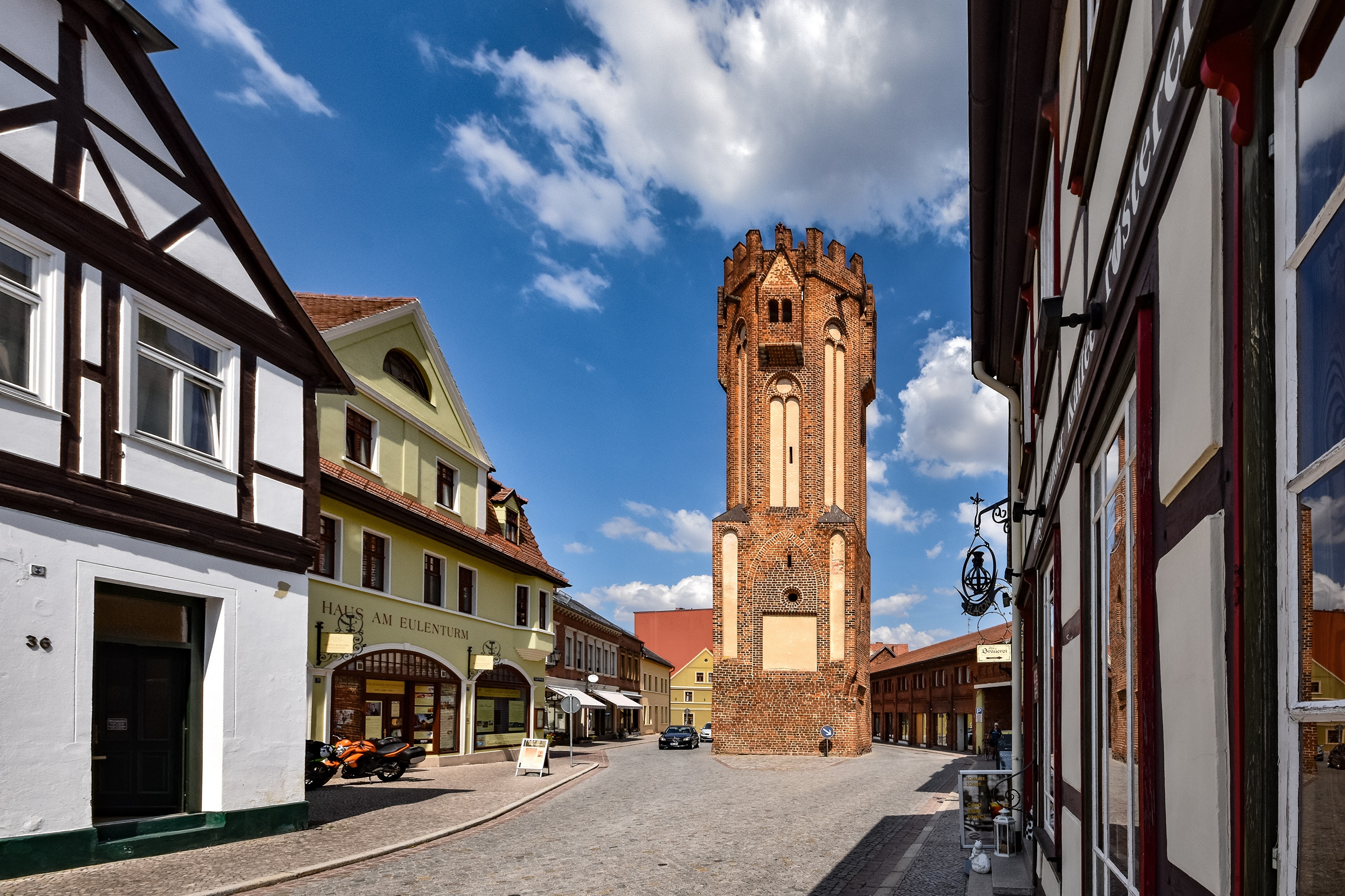 Street view with a brick tower in Germany HD Wallpaper
