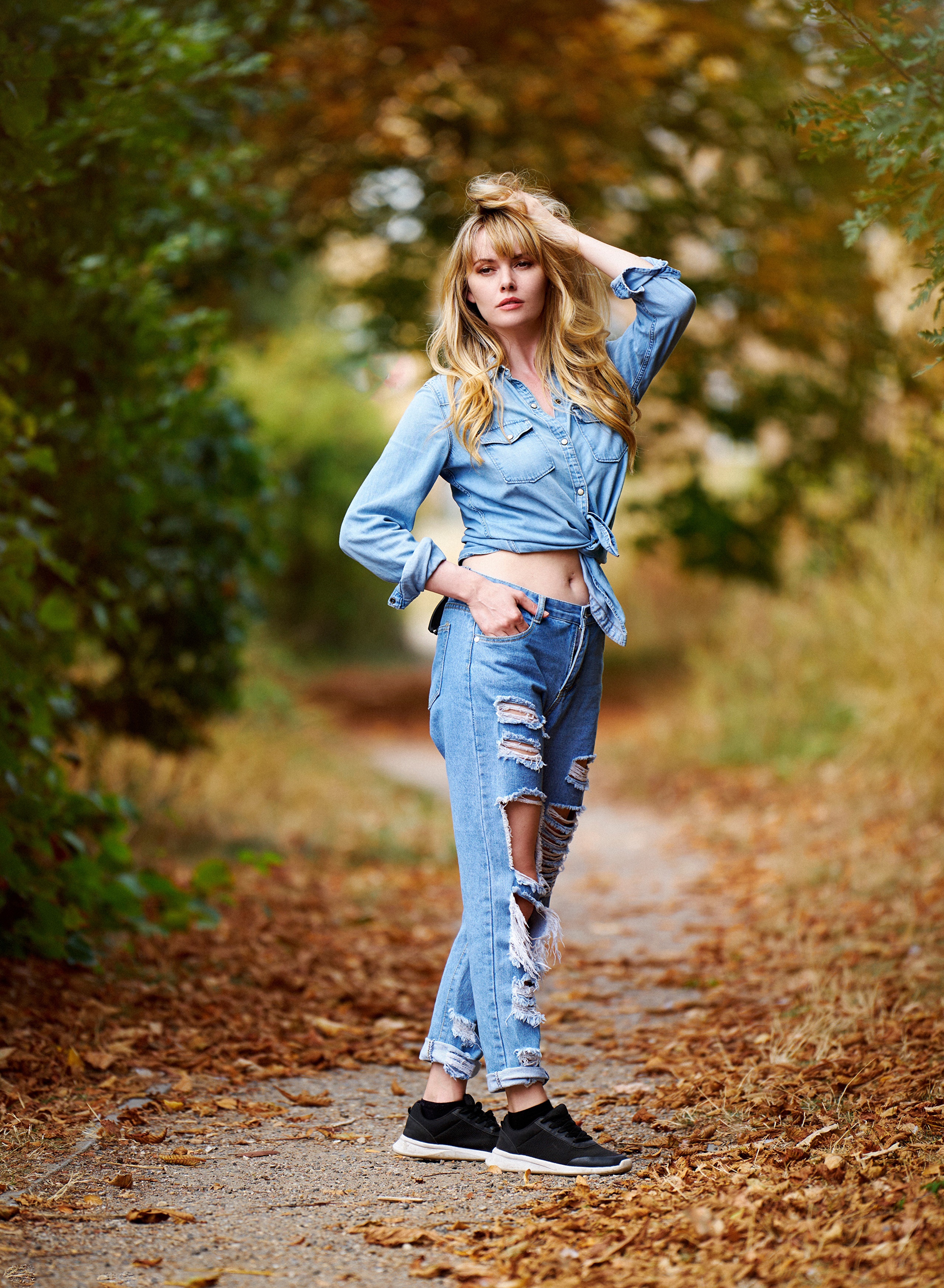 Blonde girl in ripped jeans and denim shirt posing HD Phone Wallpaper