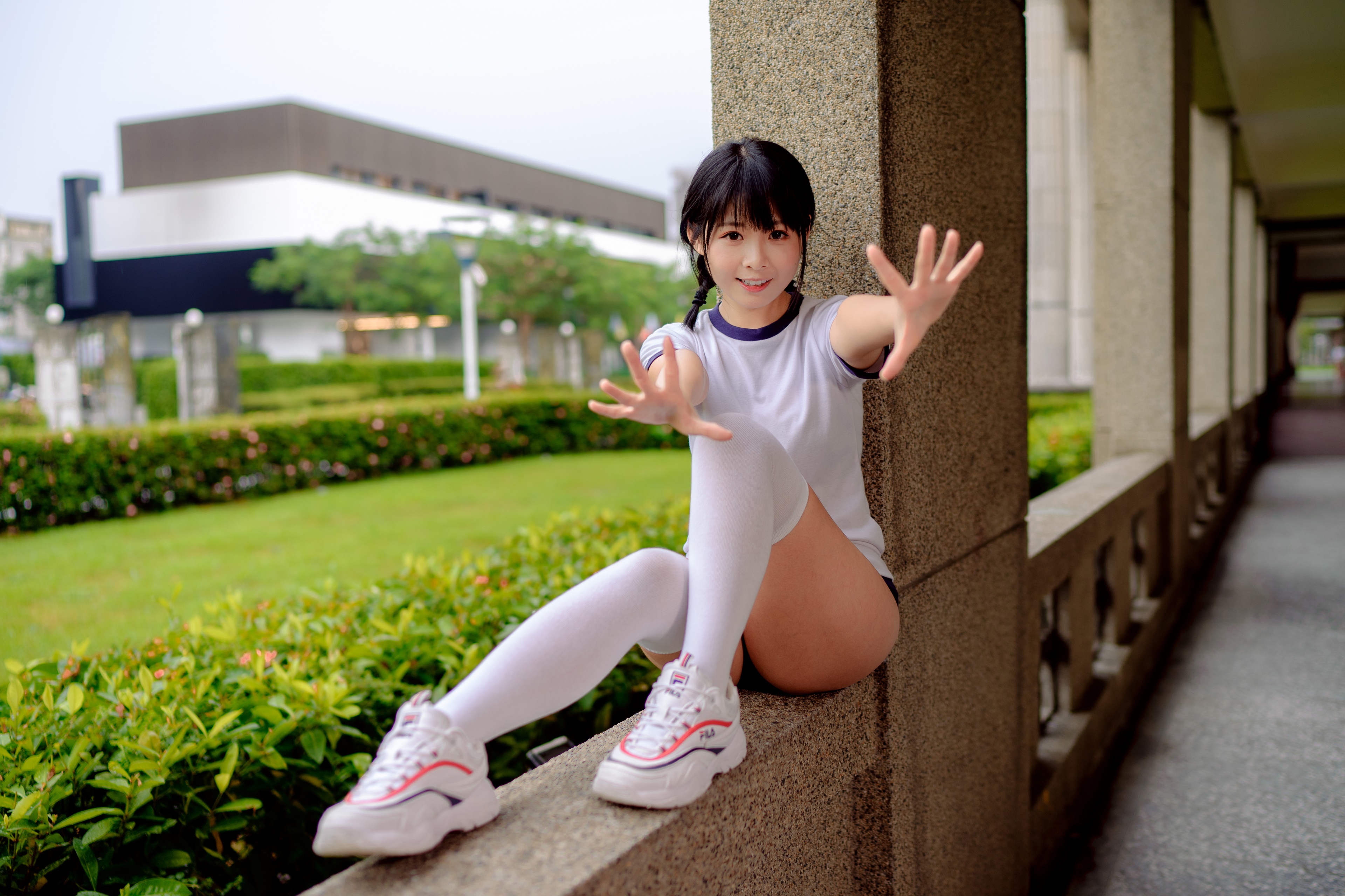 Brunette girl in gym clothes sitting outdoors HD Wallpaper