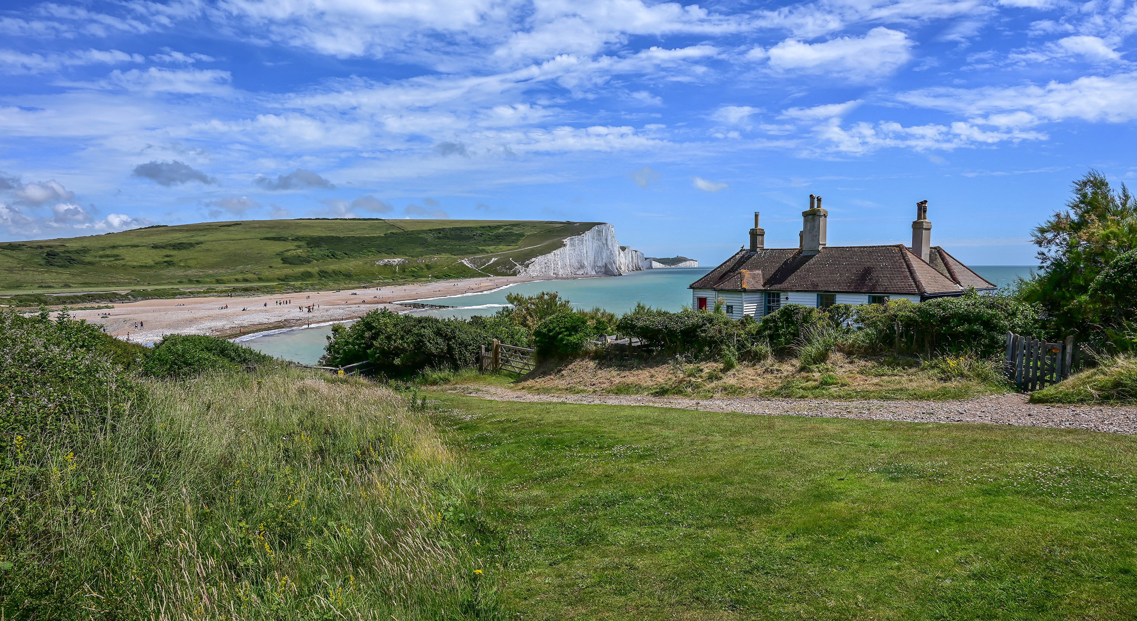 Cuckmere Beach Coastline with Houses in England HD Wallpaper