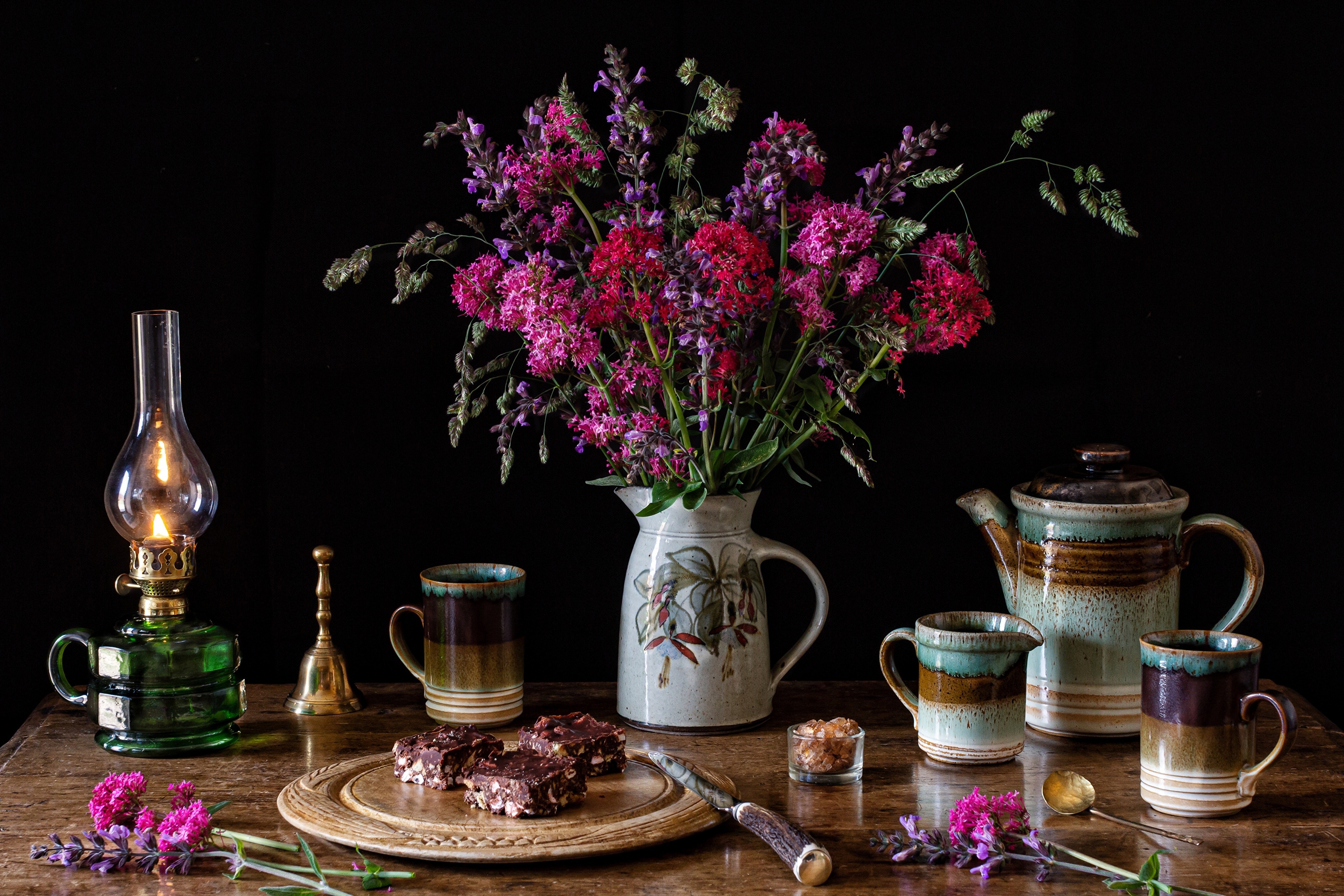 Still-life with flowers, cakes, and kerosene lamp HD Wallpaper