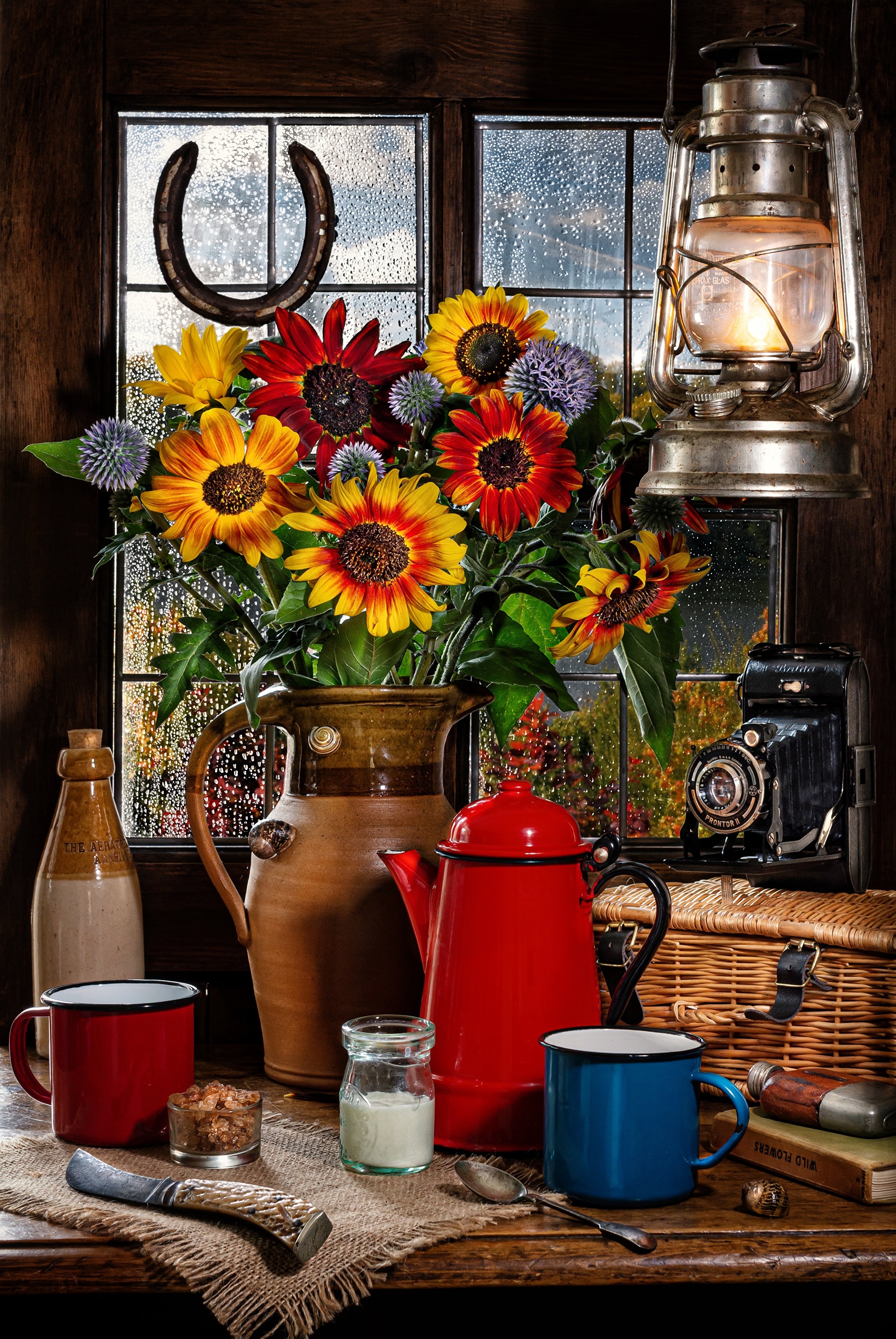 Still life with sunflowers, kerosene lamp, and camera HD Phone Wallpaper