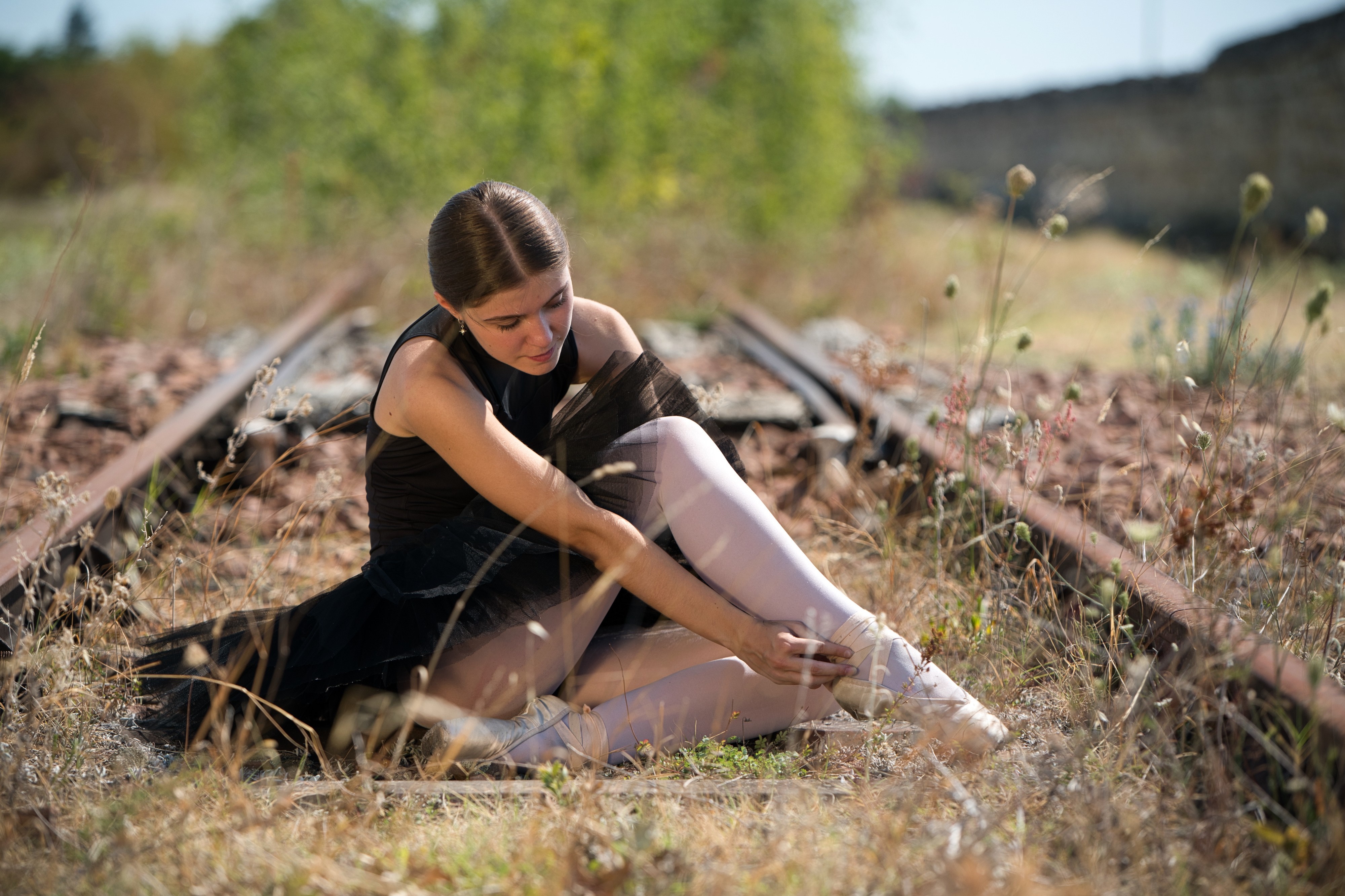 Ballerina sitting on train tracks HD Wallpaper
