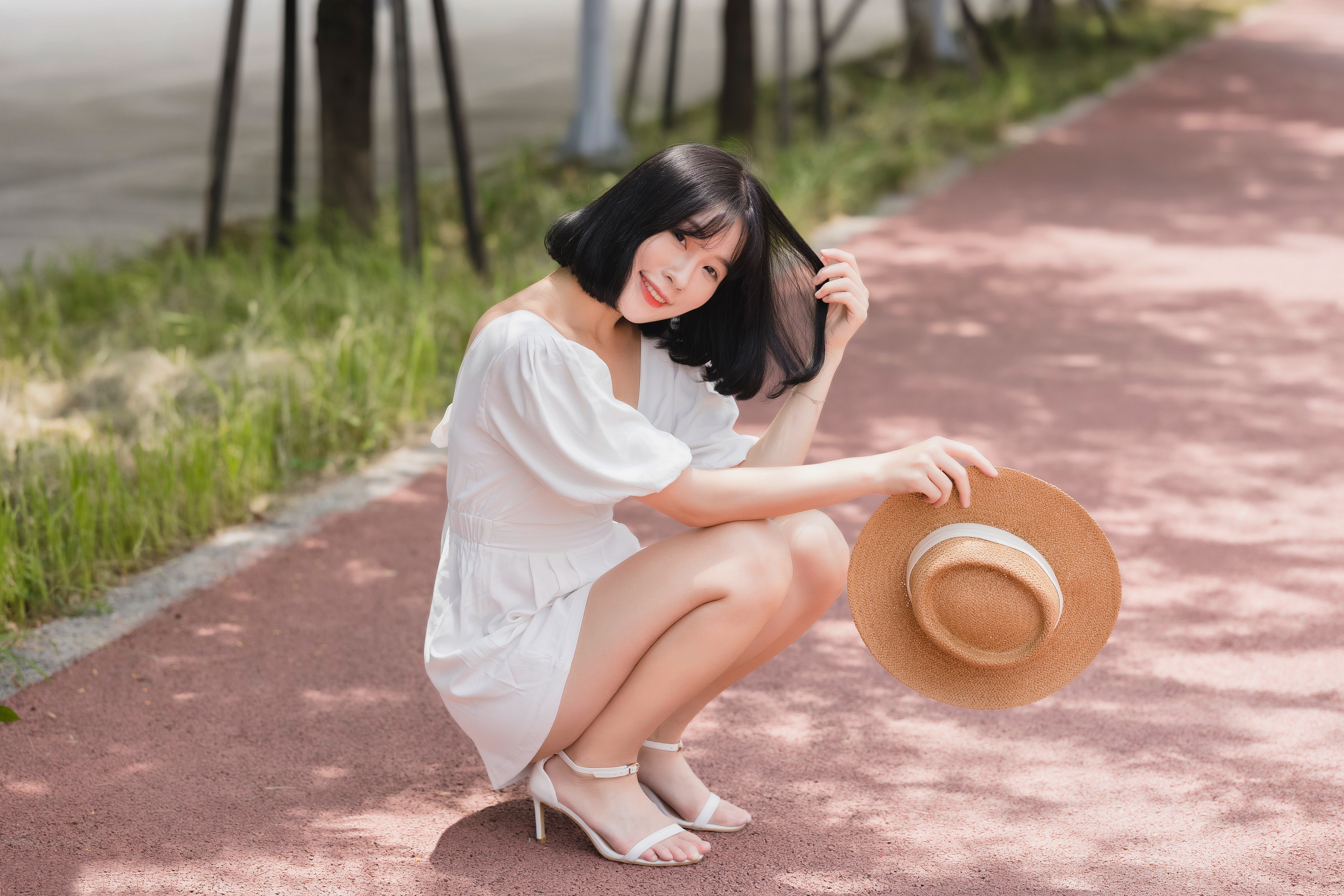 Asian woman in white dress holding a hat HD Wallpaper