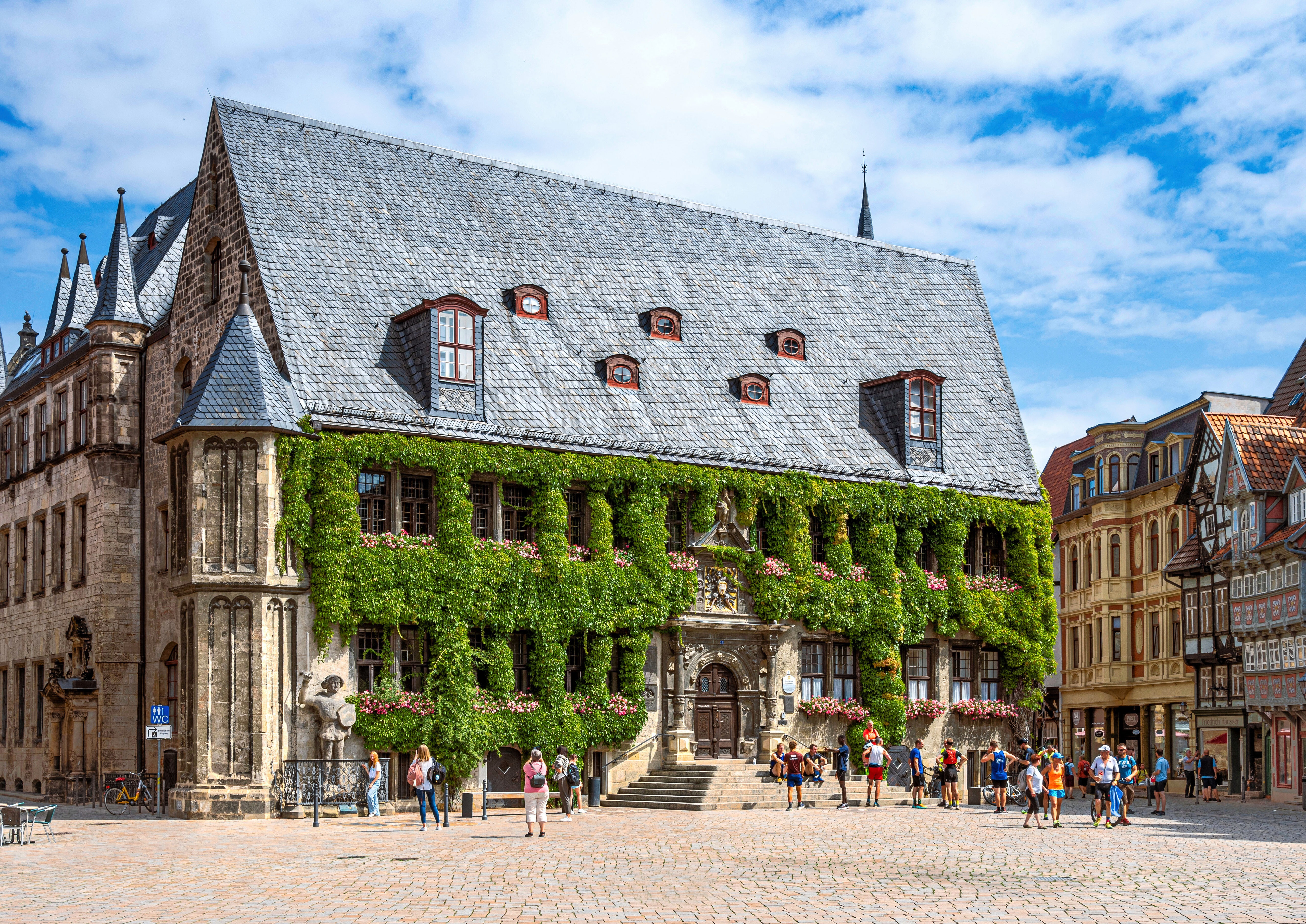 Quedlinburg Town Square with Historic Buildings and People HD Wallpaper