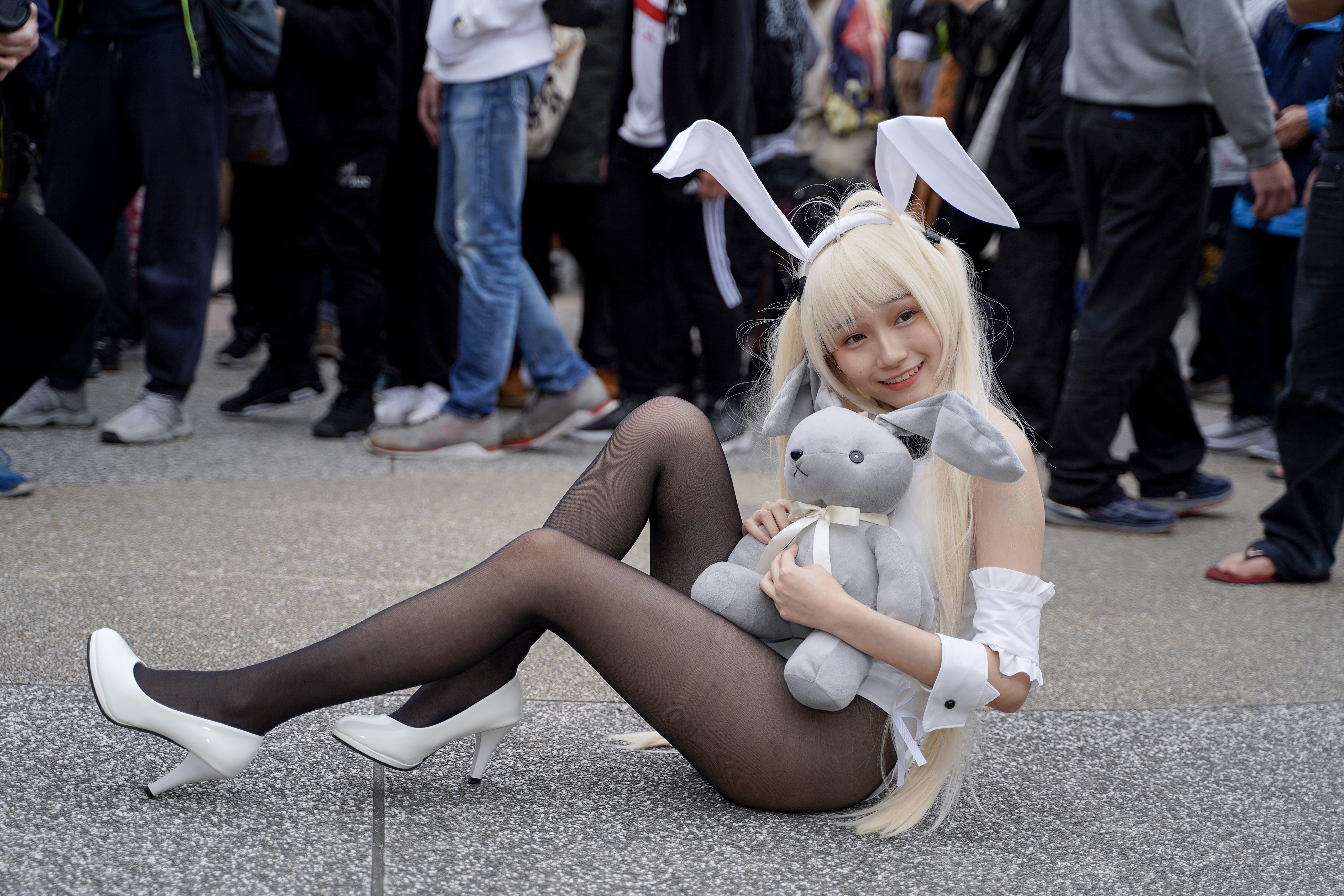 Bunnygirl with stuffed rabbit sitting on ground HD Wallpaper