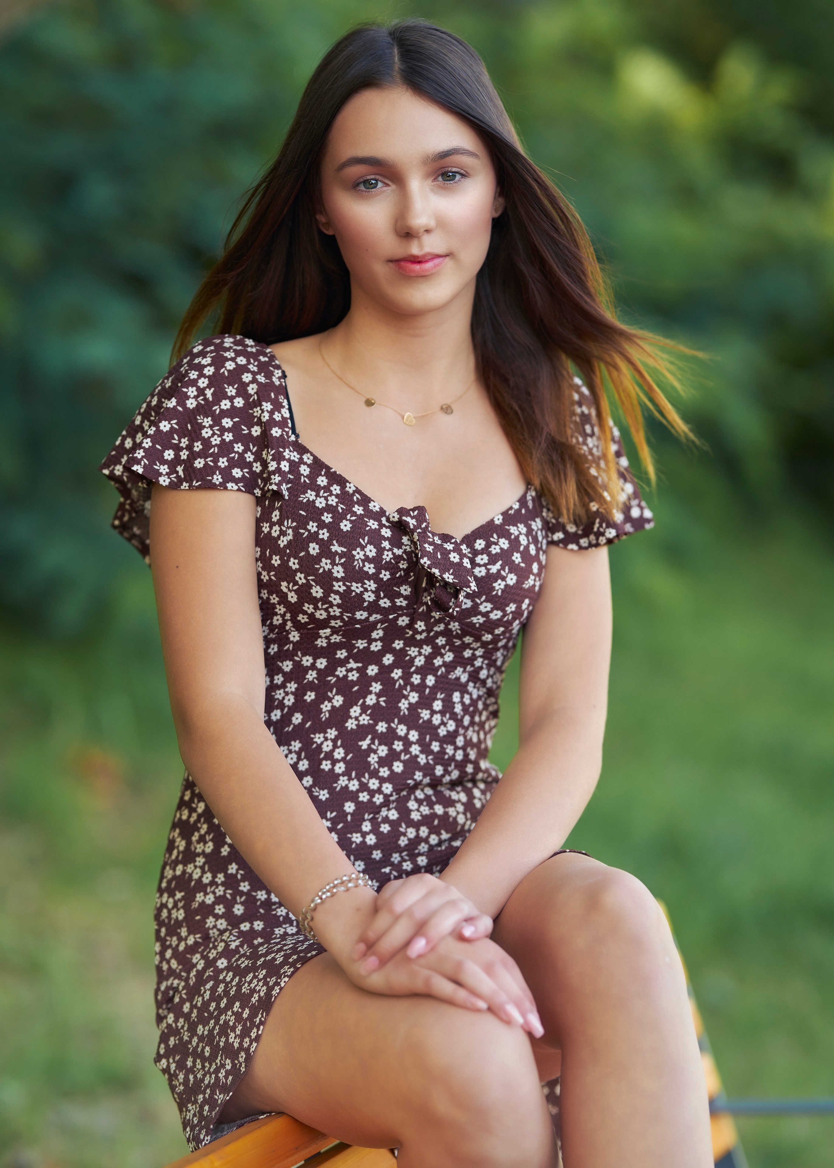 Wiktoria sitting in a floral dress HD Phone Wallpaper