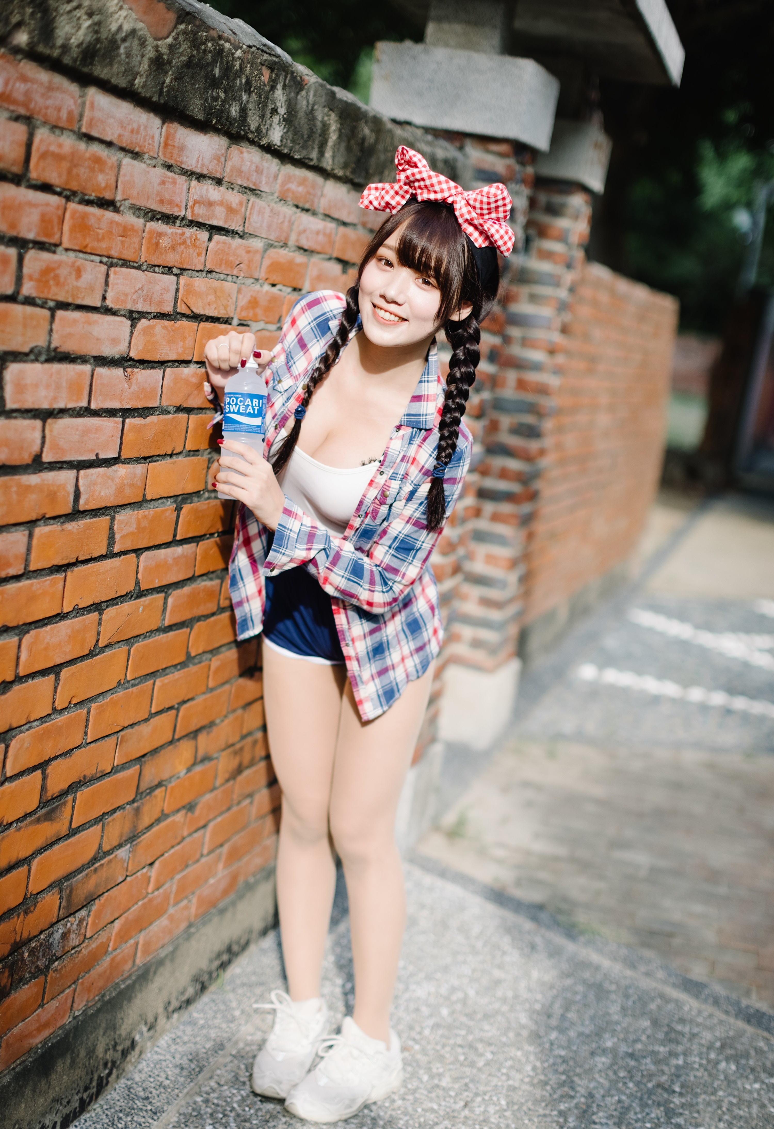 Girl with Pocari Sweat bottle by brick wall HD Phone Wallpaper