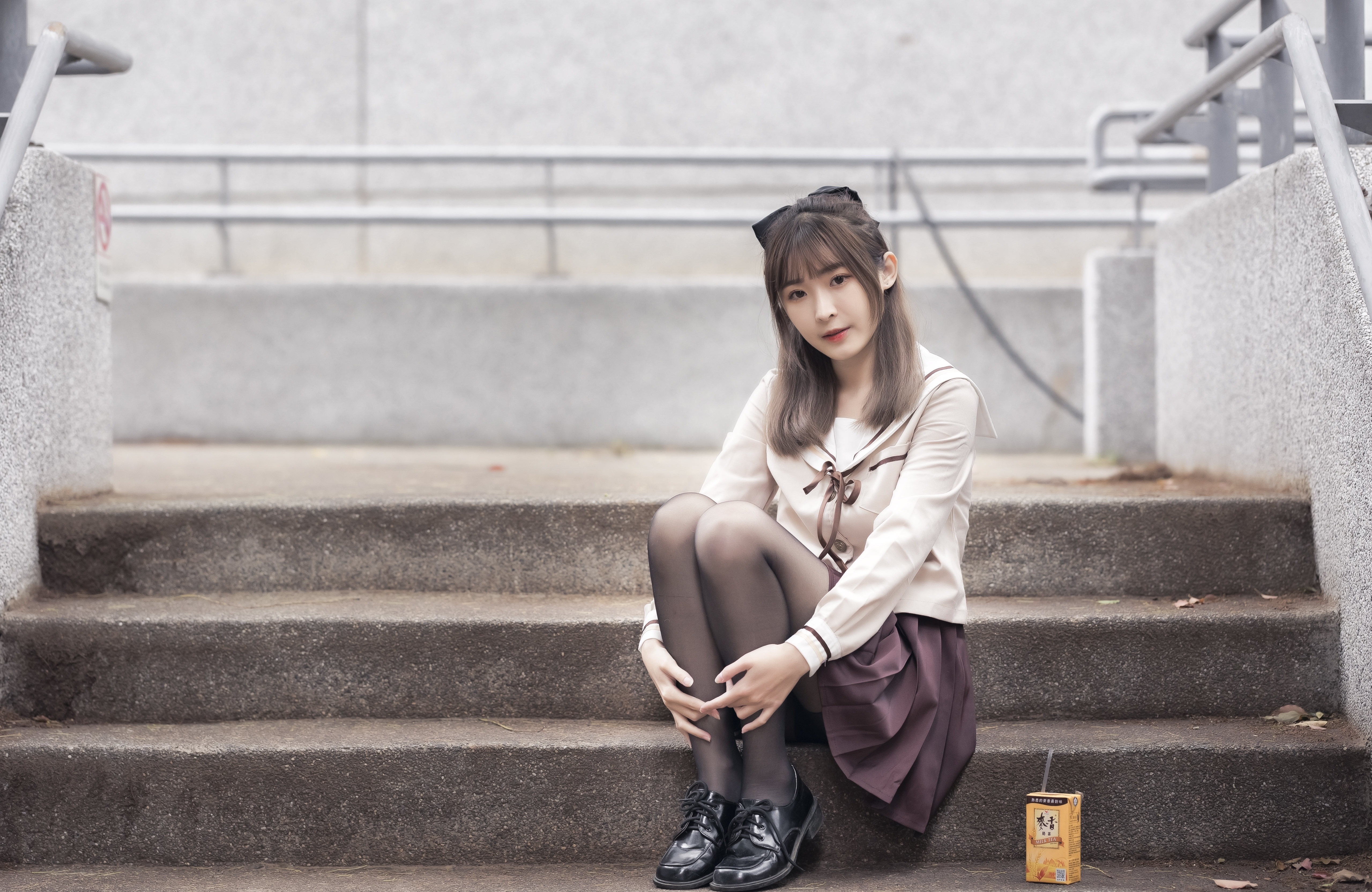 Asian girl in school uniform sitting on stairs HD Wallpaper