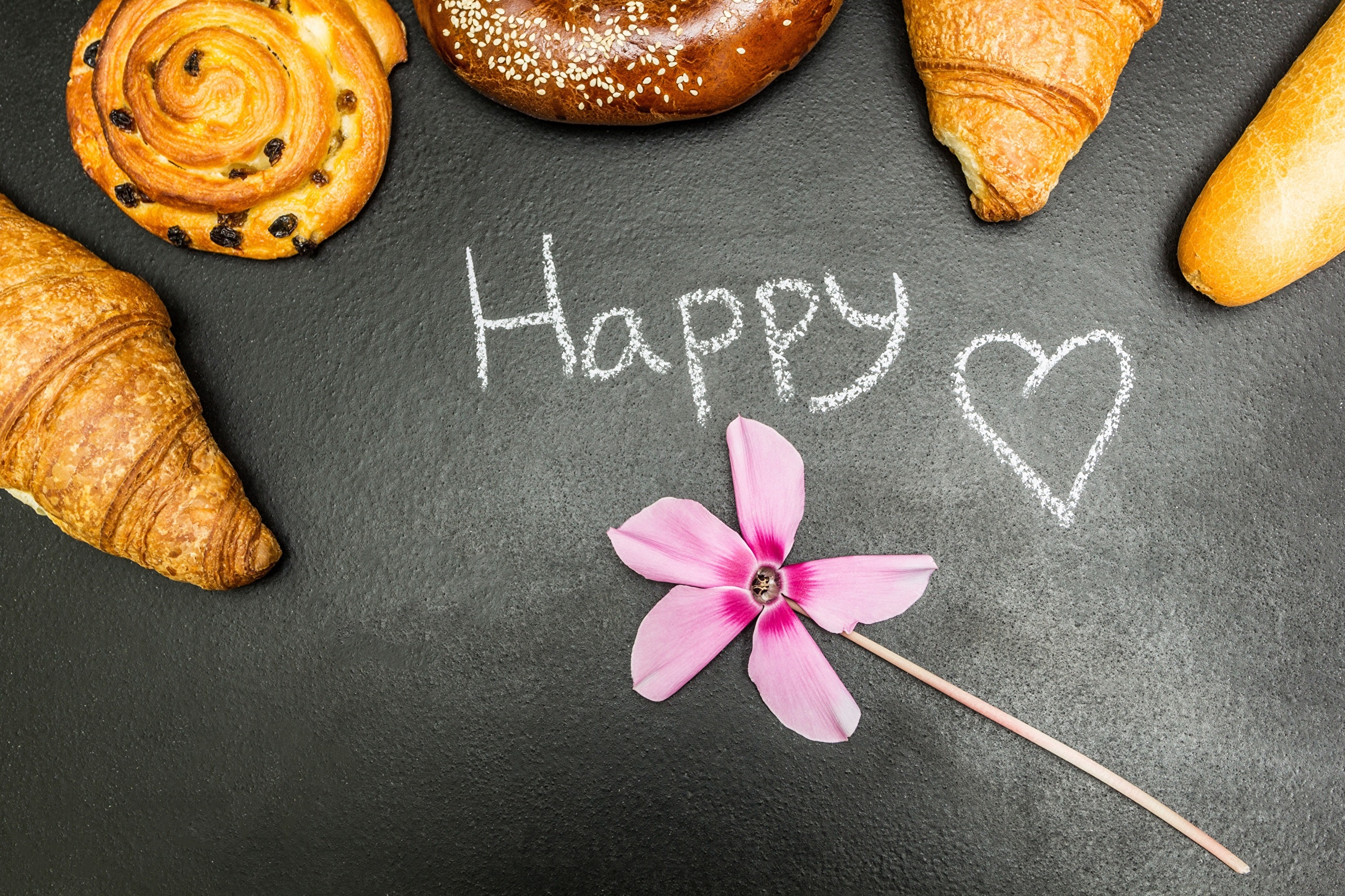Happy written in chalk with pastries and a flower HD Wallpaper