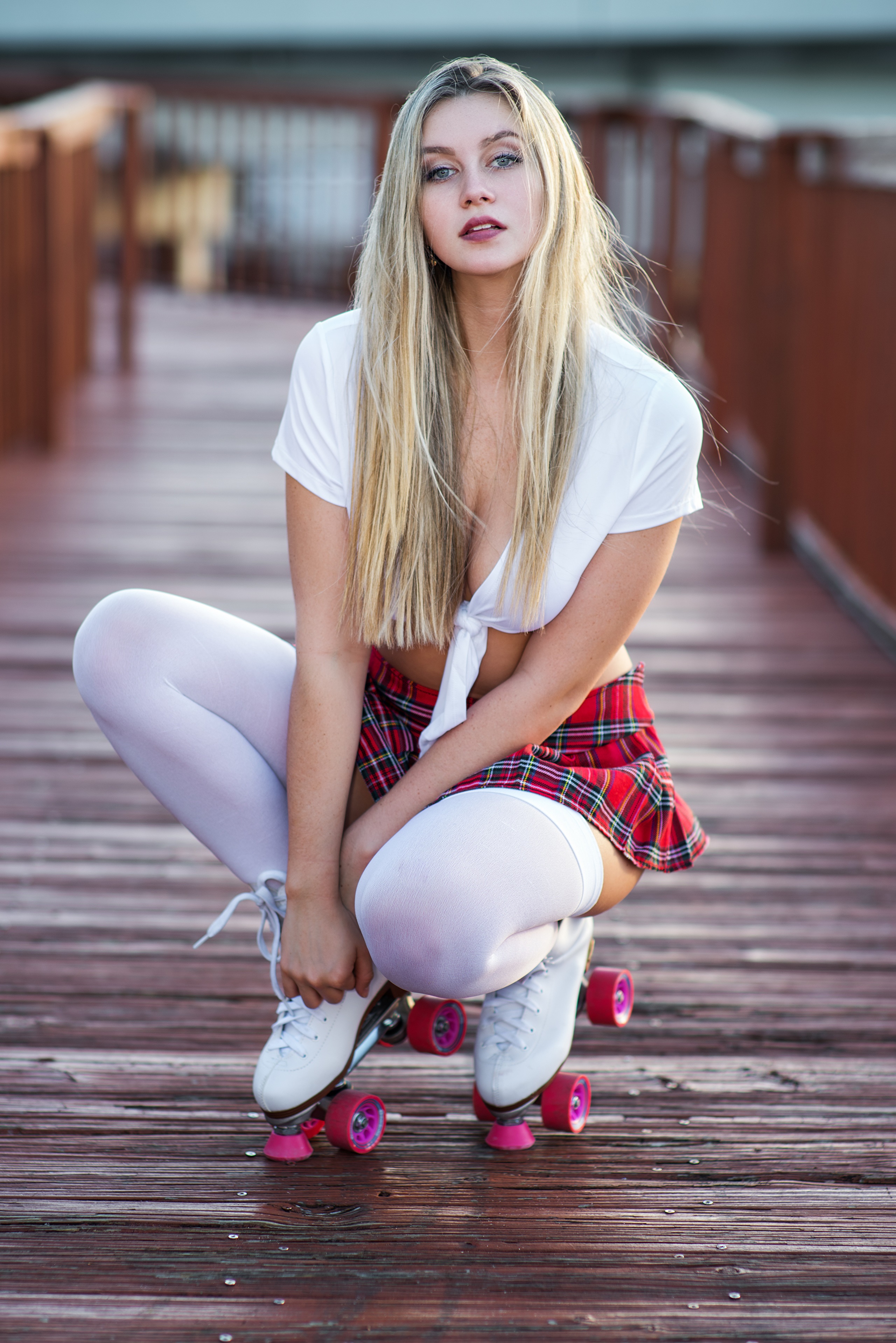 Blonde girl in school uniform on roller skates HD Phone Wallpaper