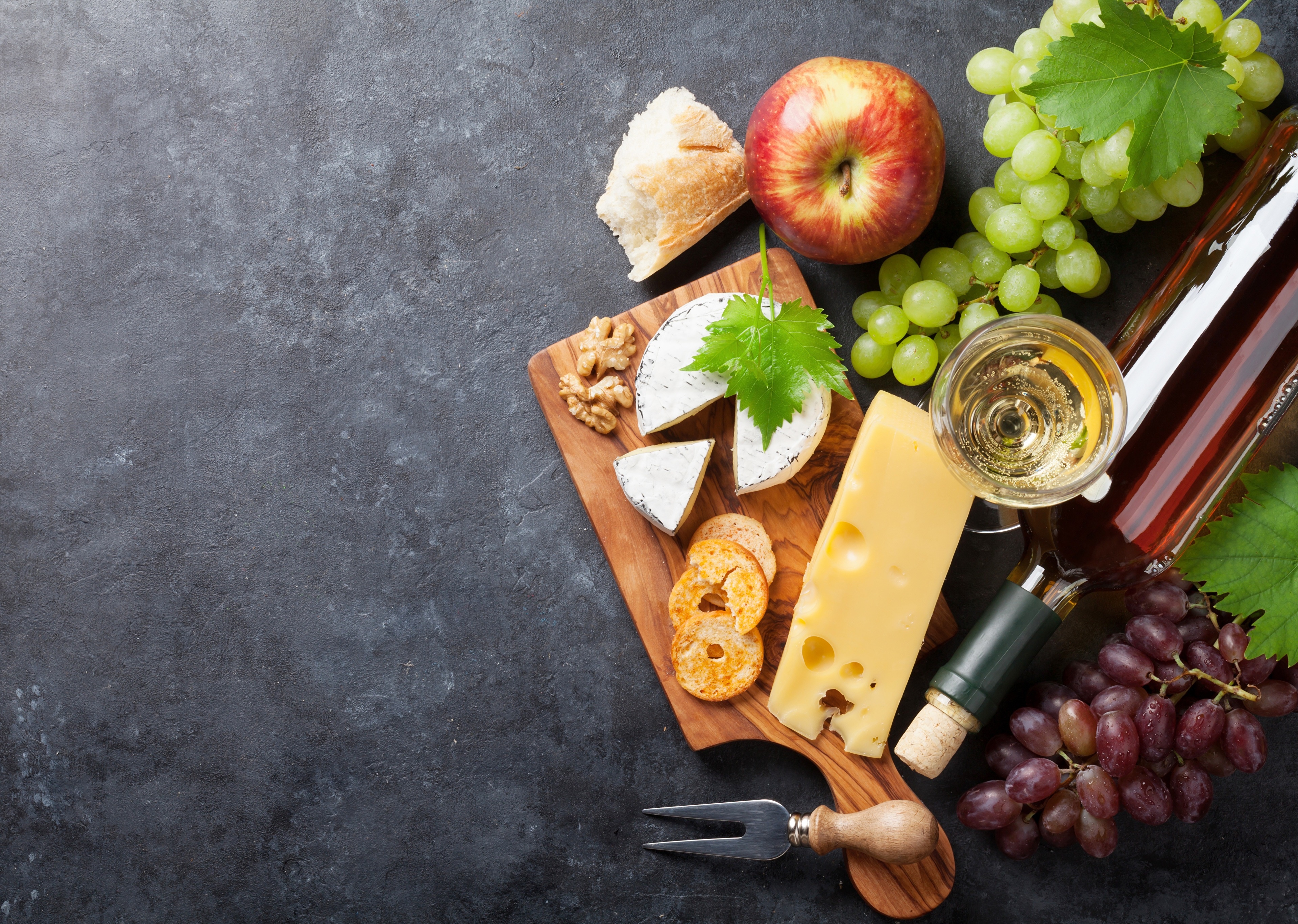 Cheese, Grapes, Apple, Wine, and Bread on Cutting Board HD Wallpaper