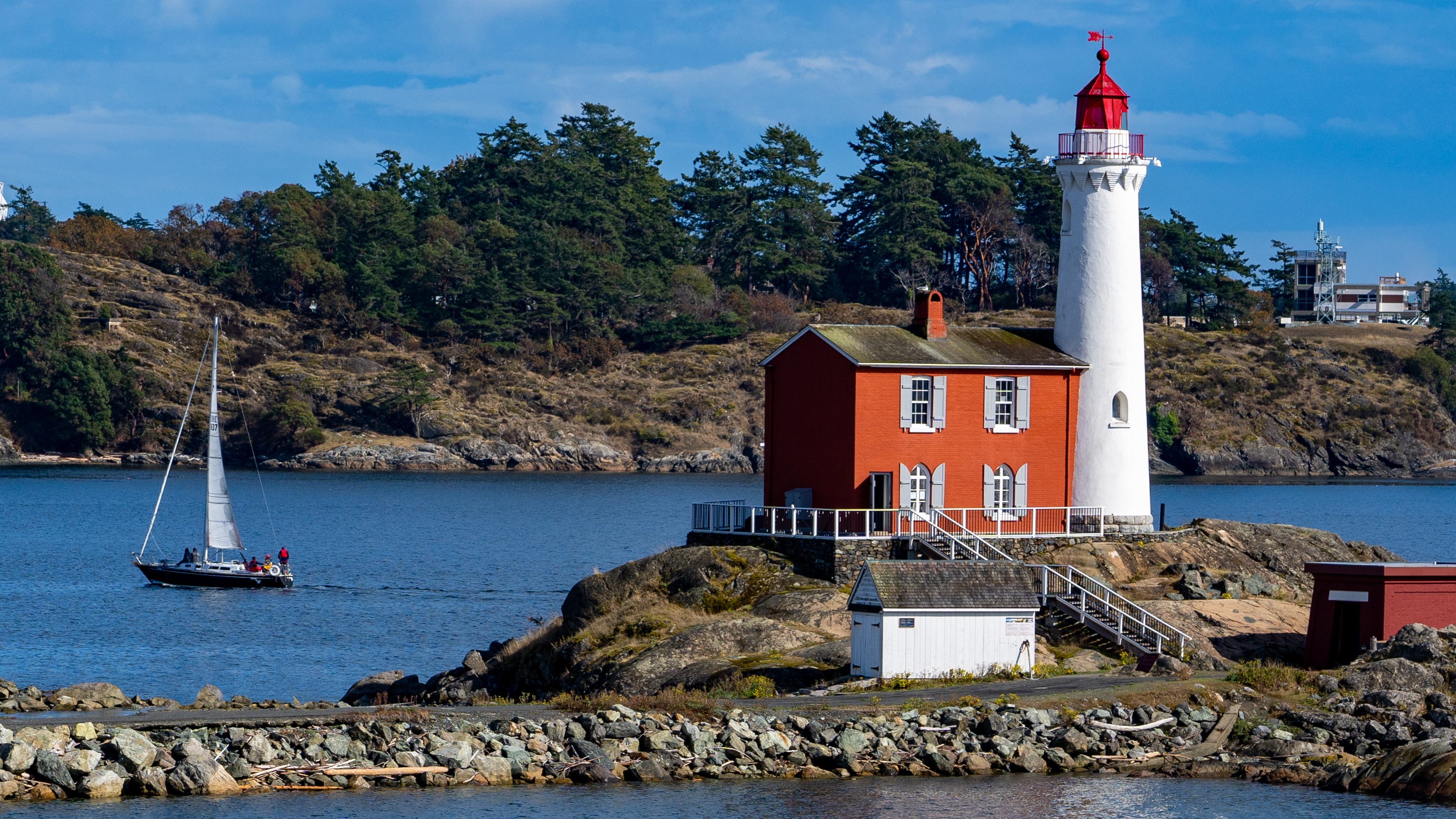 Fisgard Lighthouse and sailboat in Colwood, Canada HD Wallpaper