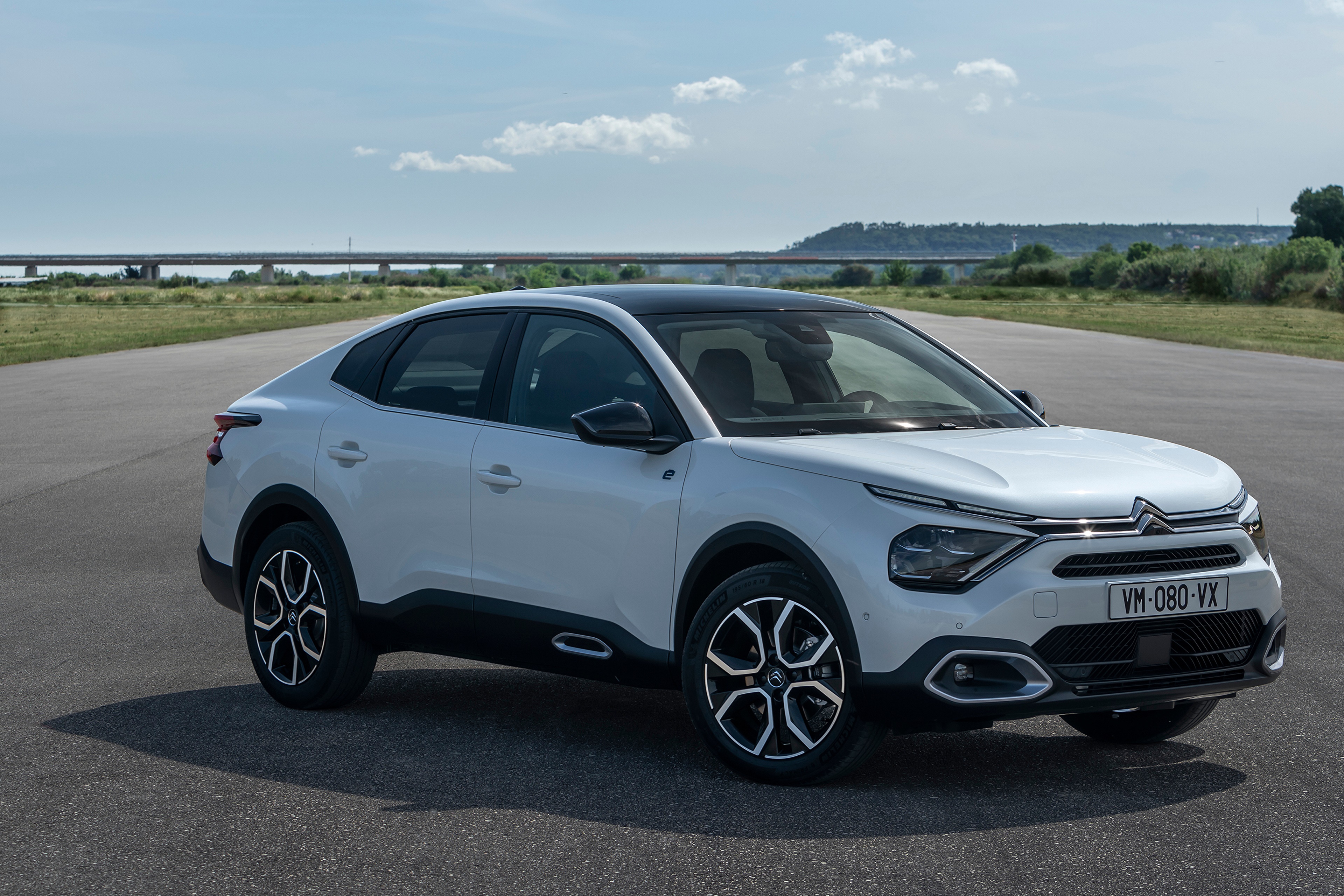 White Citroen C4 X electric car on asphalt HD Wallpaper