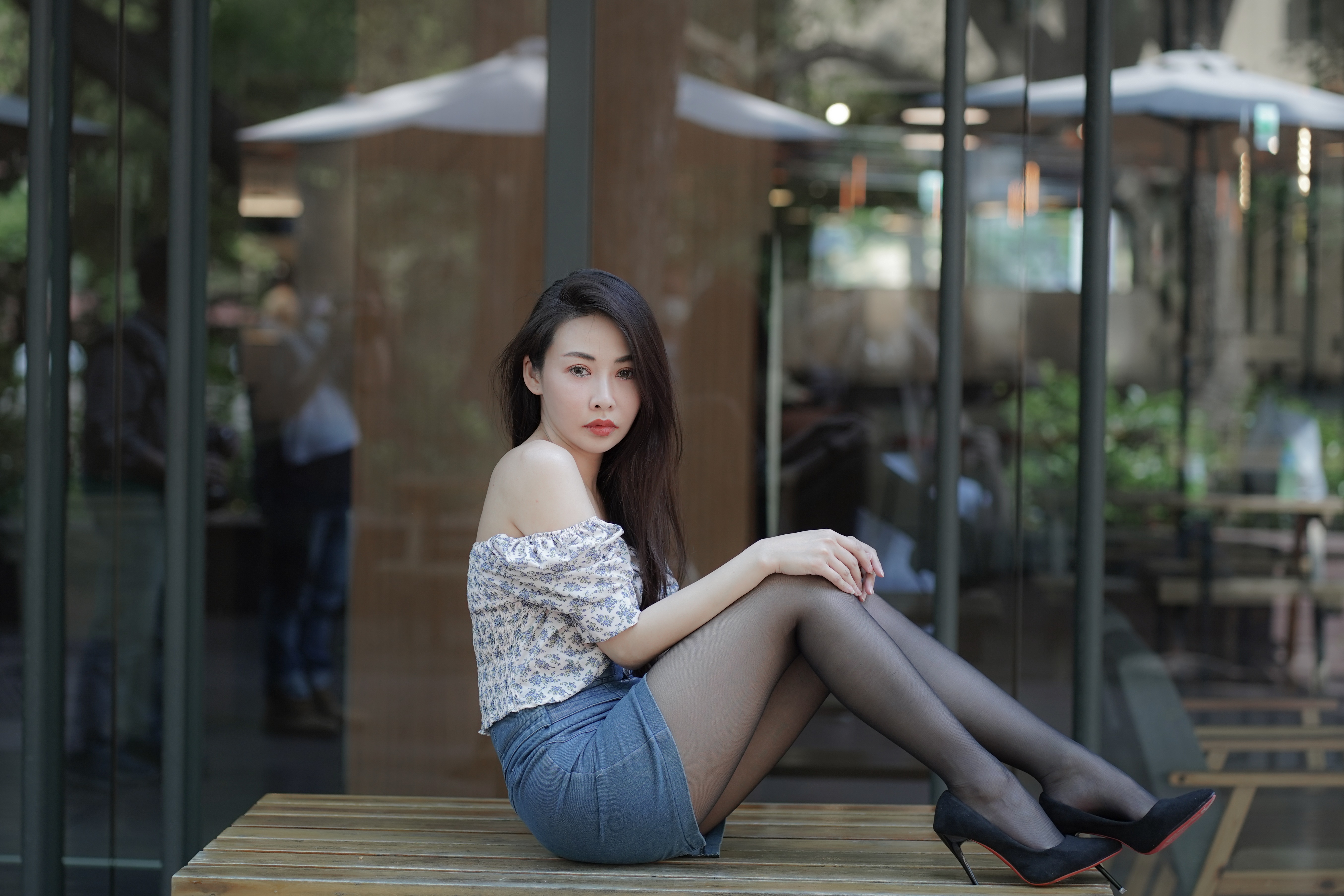 Asian woman in skirt and pantyhose sitting HD Wallpaper