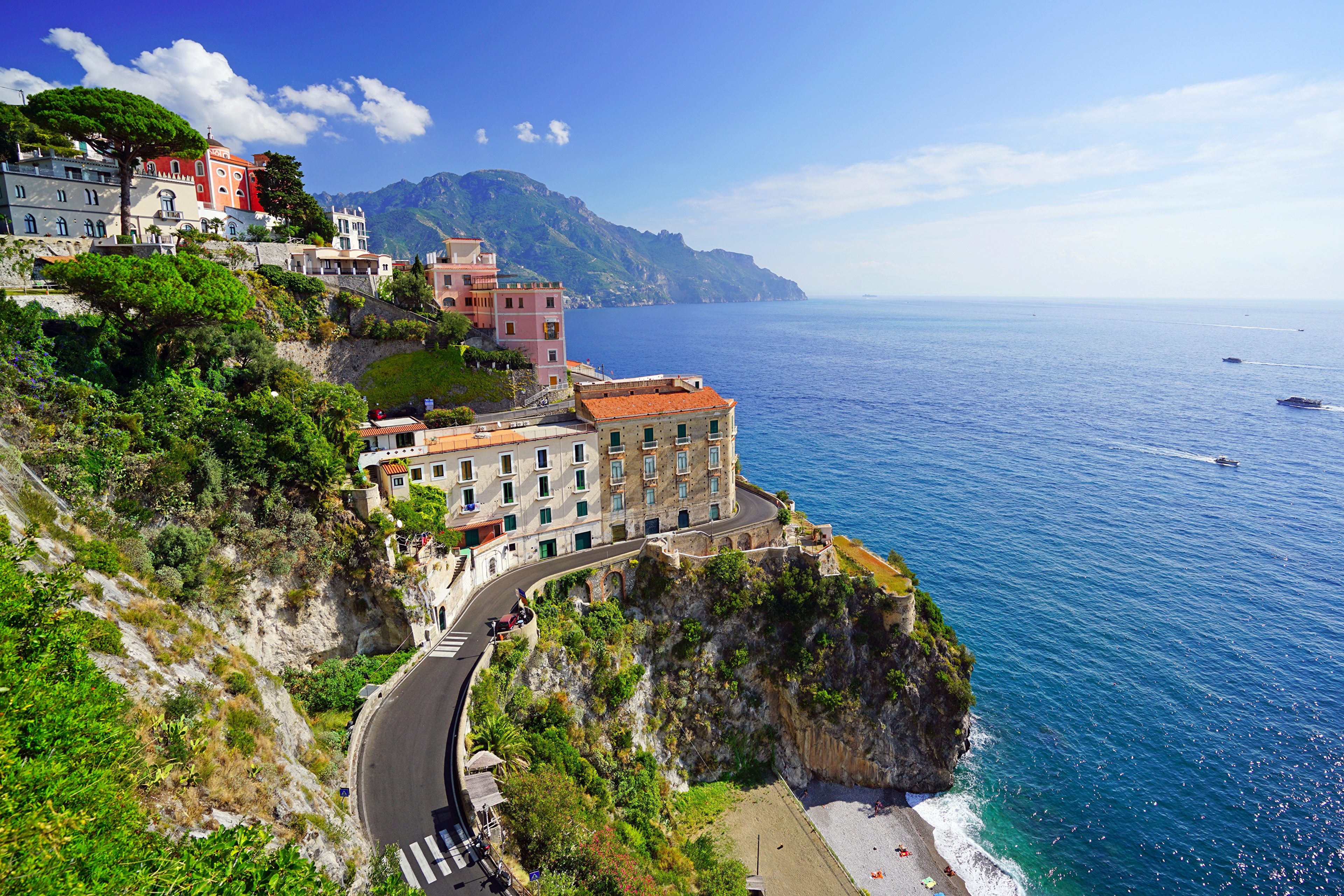 Houses on a cliffside road overlooking the sea in Atrani, Italy HD Wallpaper
