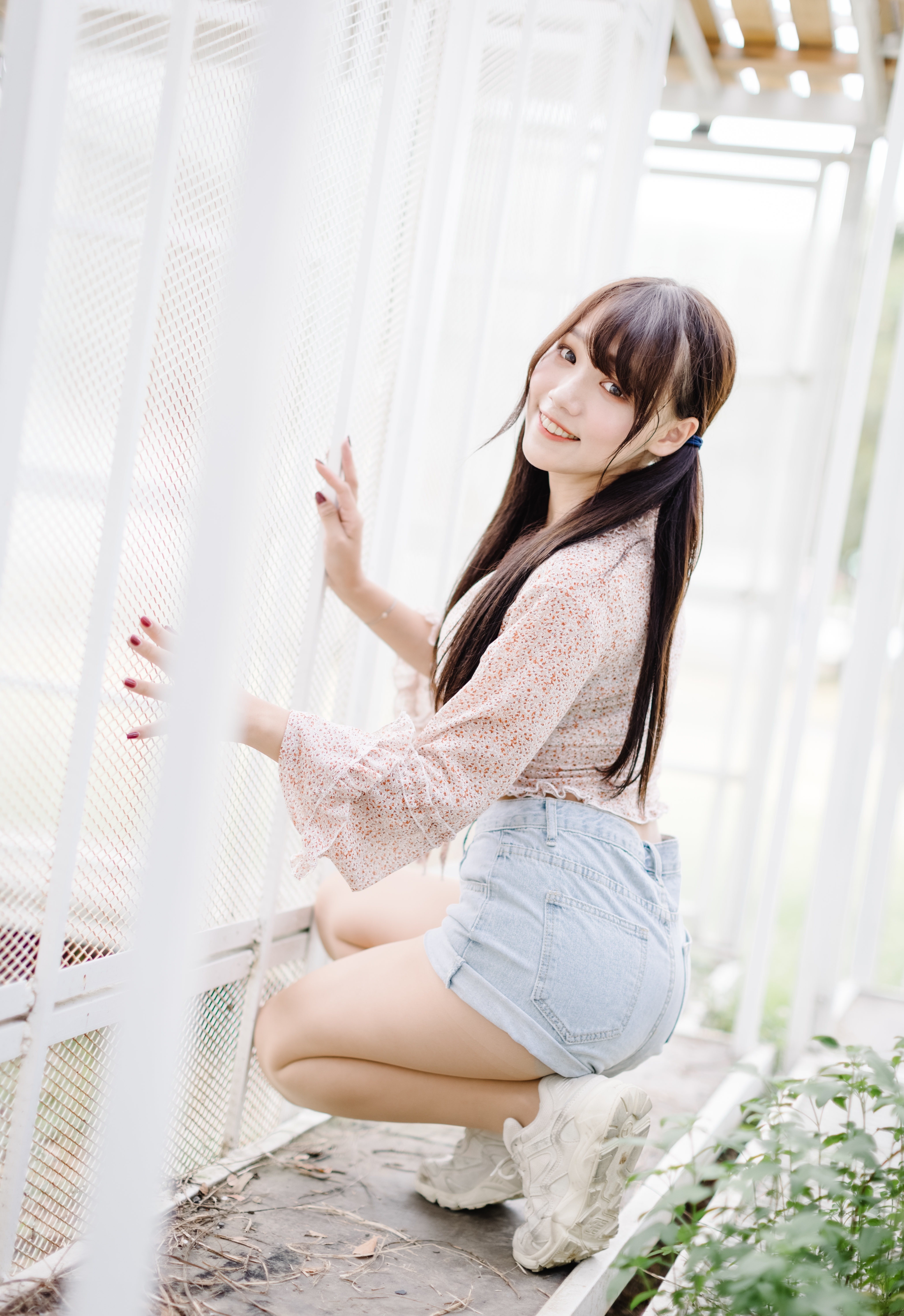 Asian girl in blouse and shorts posing HD Phone Wallpaper