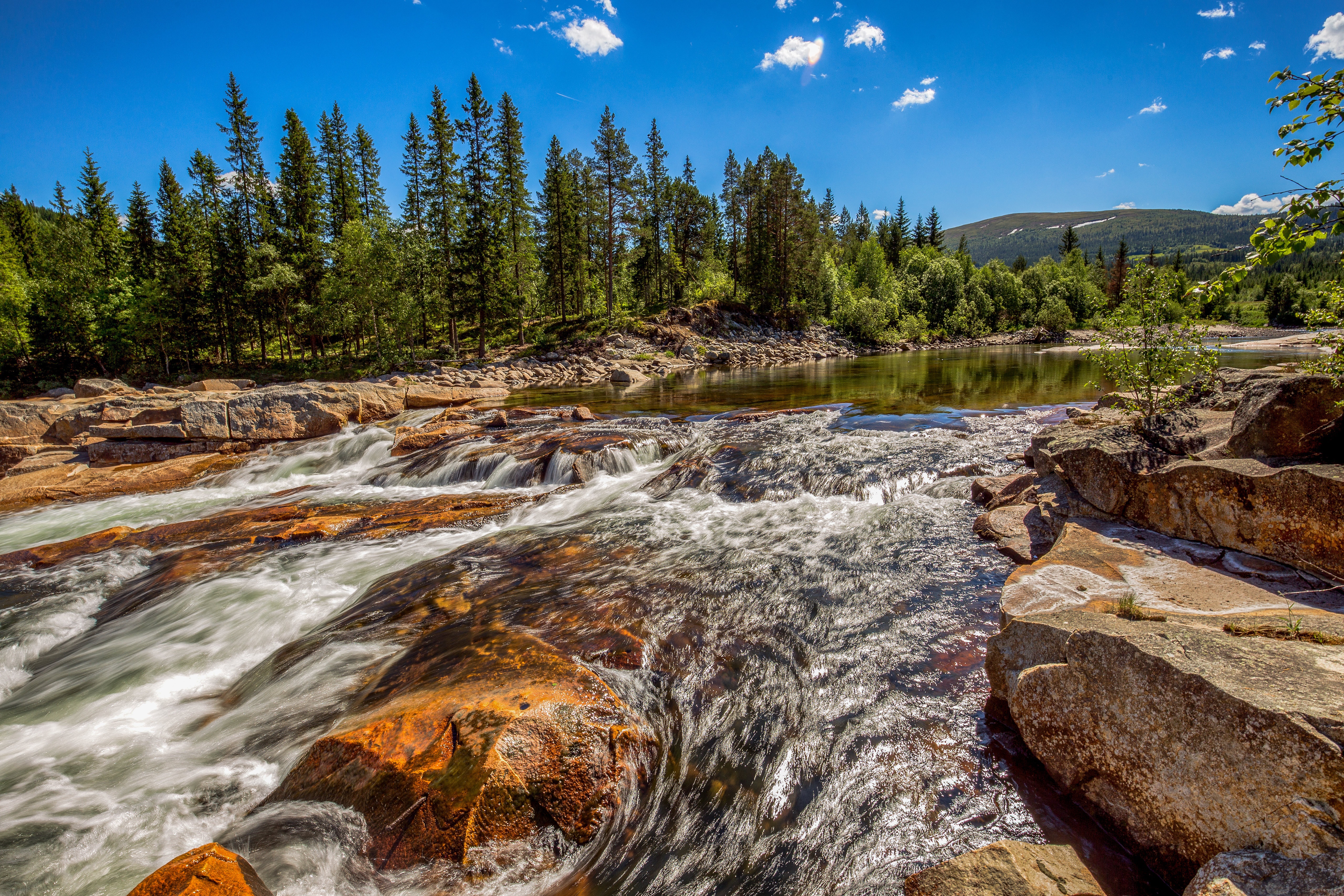 River rapids flowing over rocks in Norway HD Wallpaper