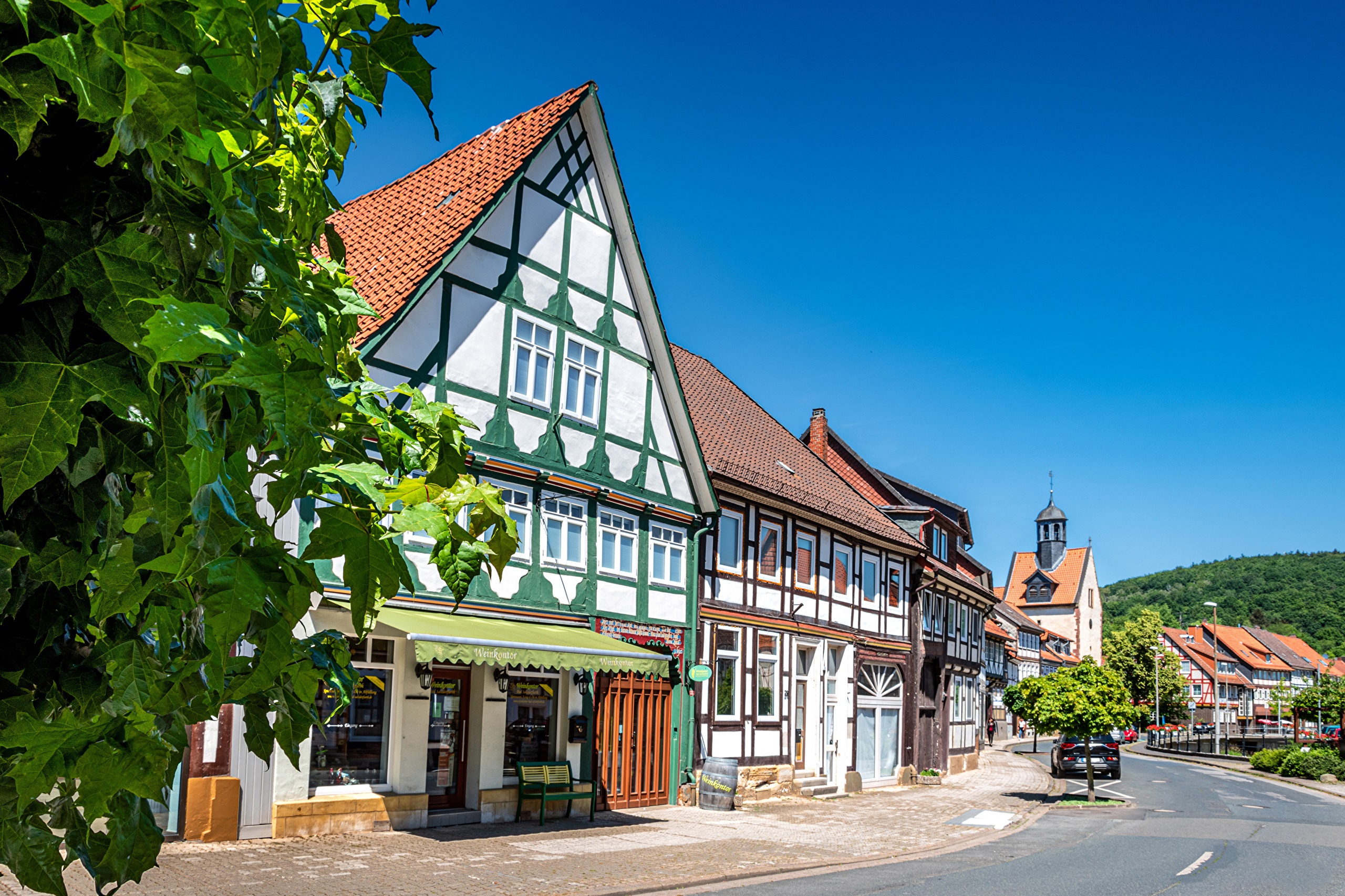 Half-timbered houses on a street in Bad Salzdetfurth, Germany HD Wallpaper