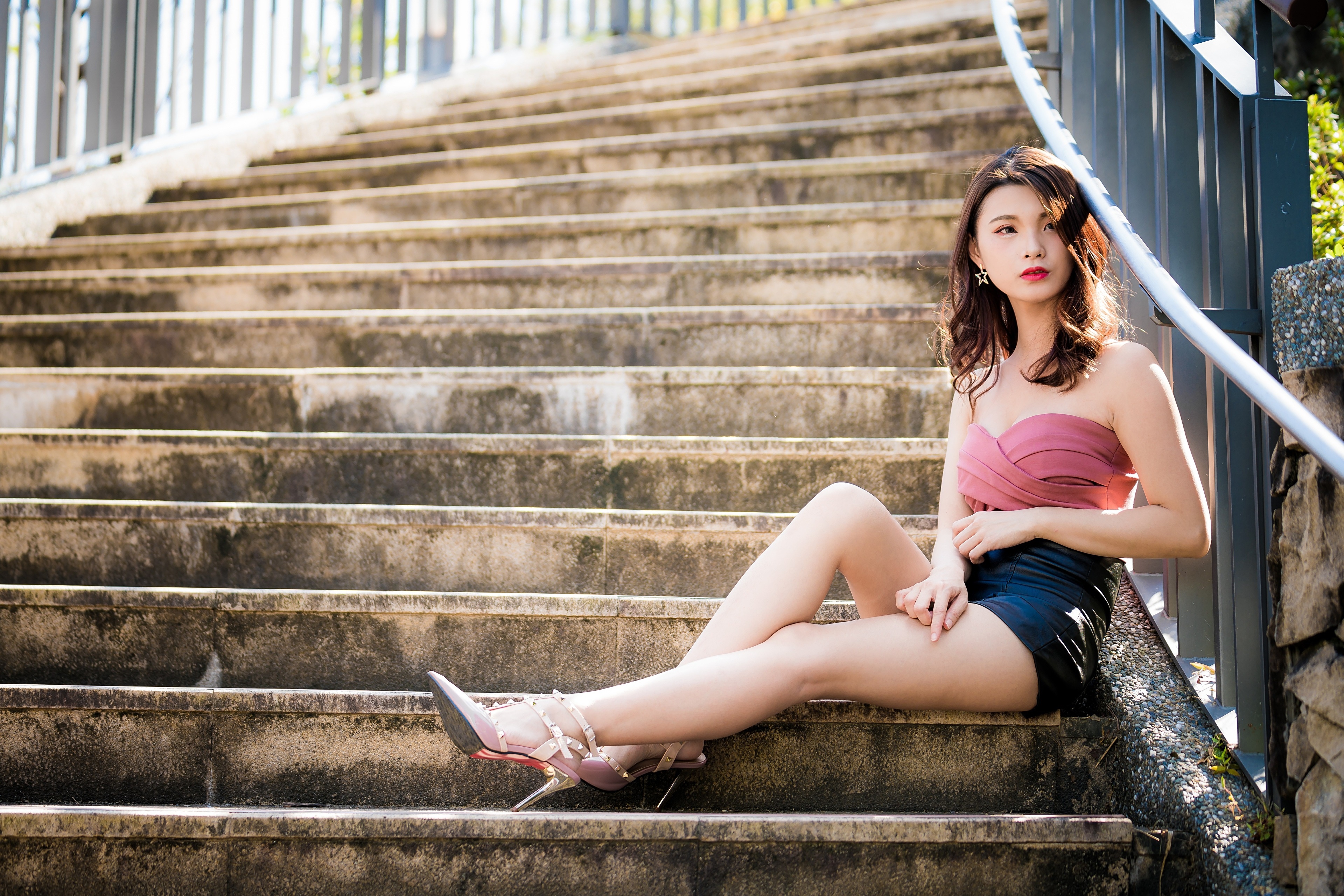 Asian woman with brown hair sitting on stairs HD Wallpaper