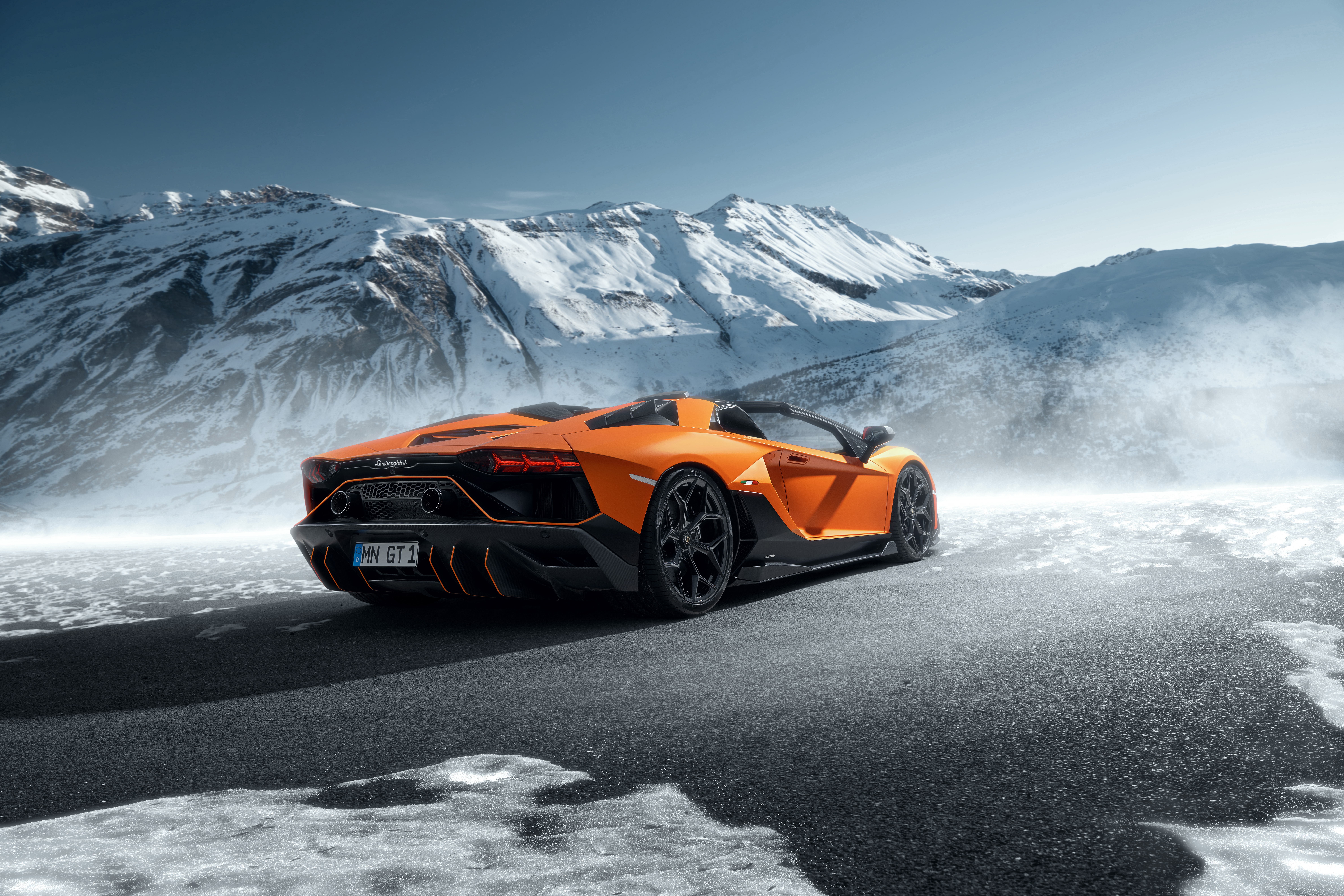 Orange Lamborghini Aventador SVJ Roadster in Snowy Mountains HD Wallpaper