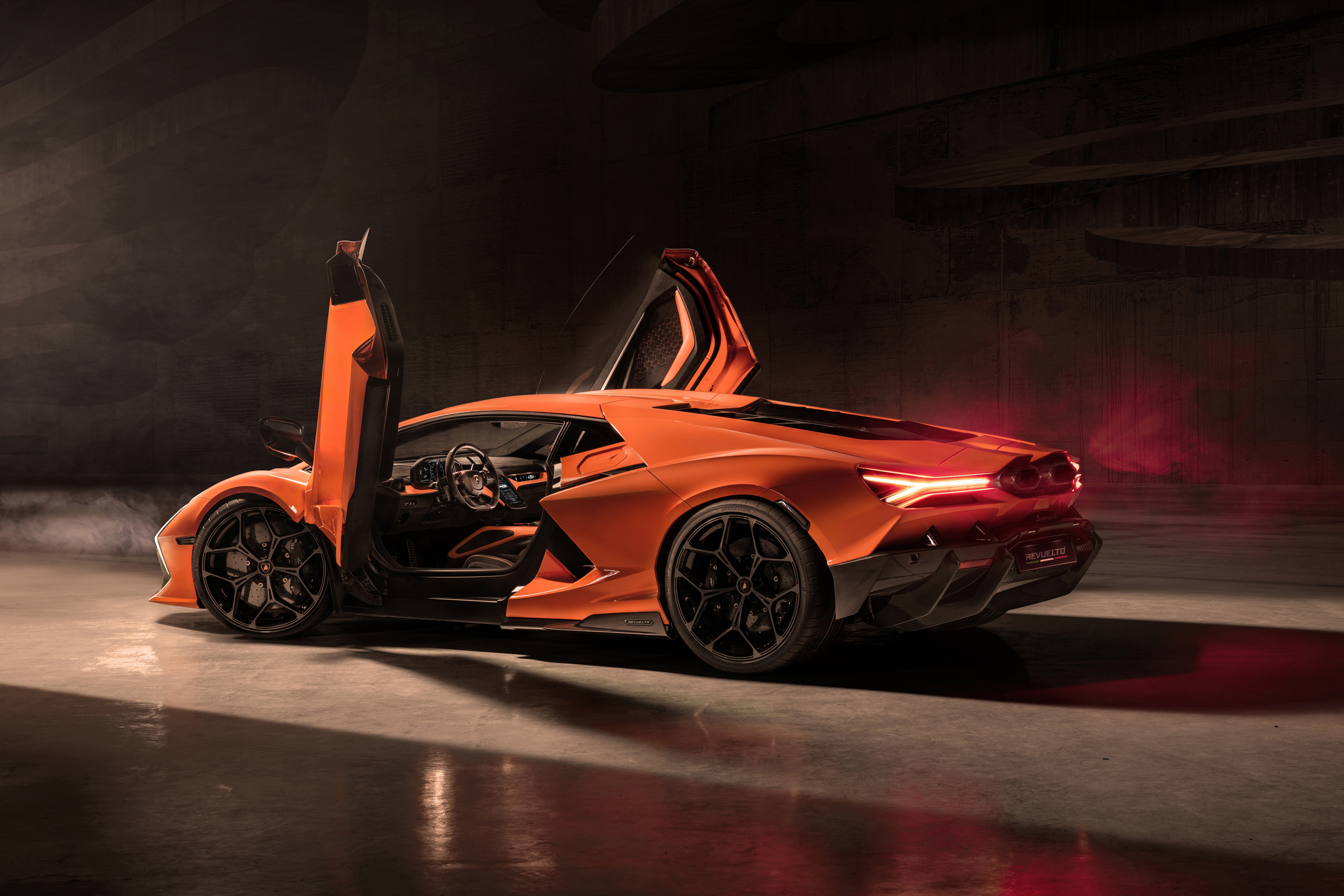 Lamborghini Revuelto with scissor doors open HD Wallpaper