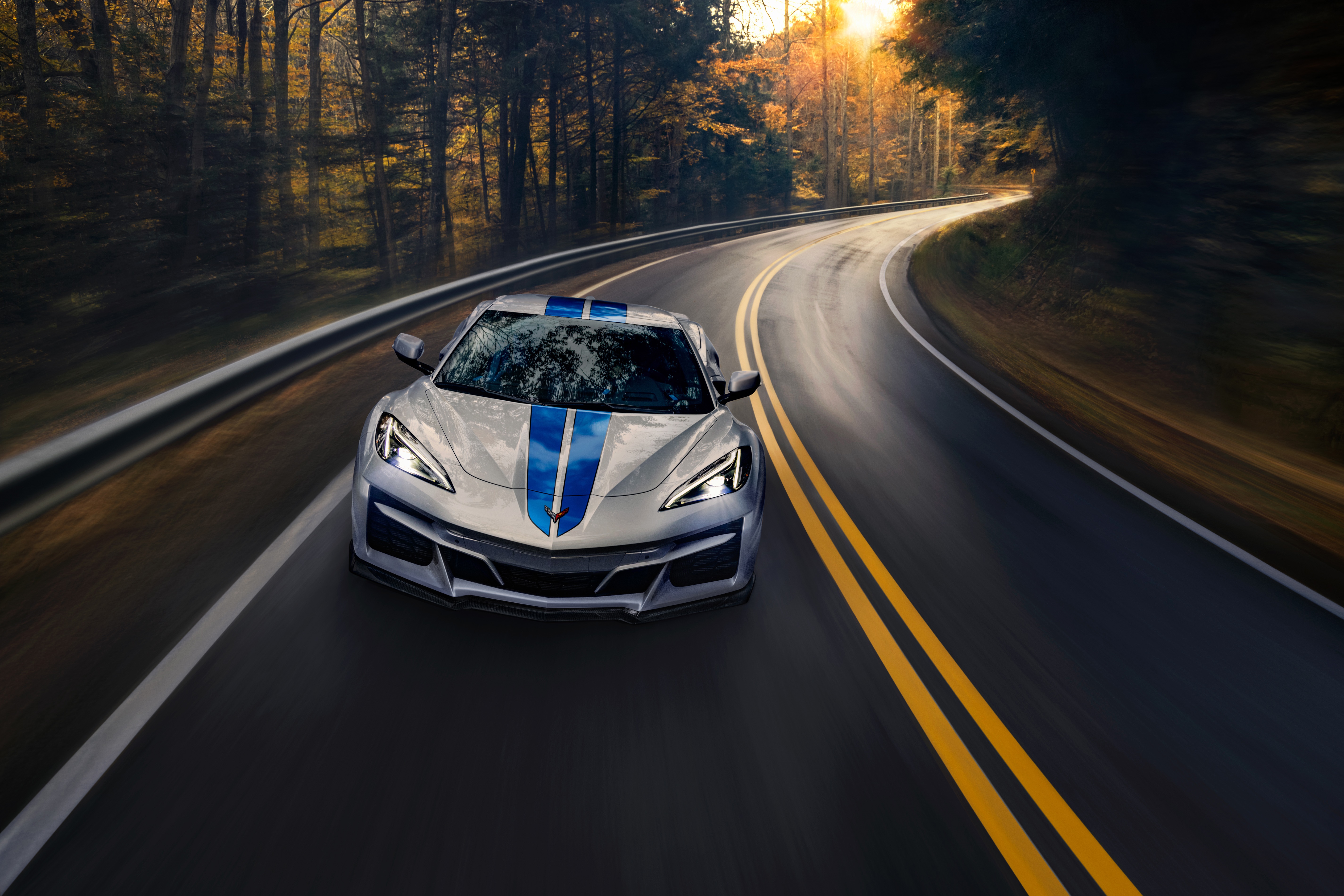 2024 Chevrolet Corvette Eray on a winding road HD Wallpaper