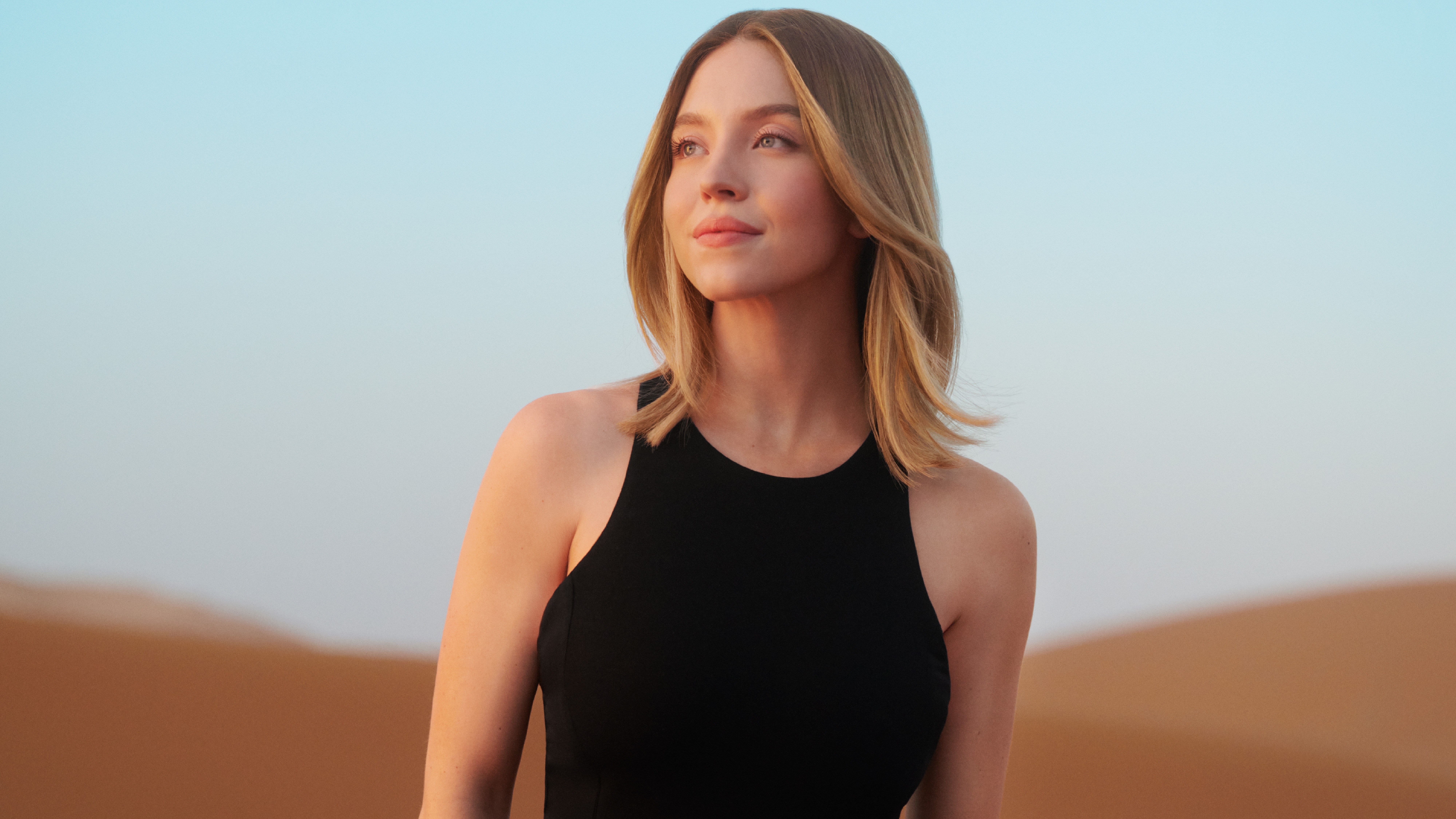 Sydney Sweeney in a black top in the desert HD Wallpaper