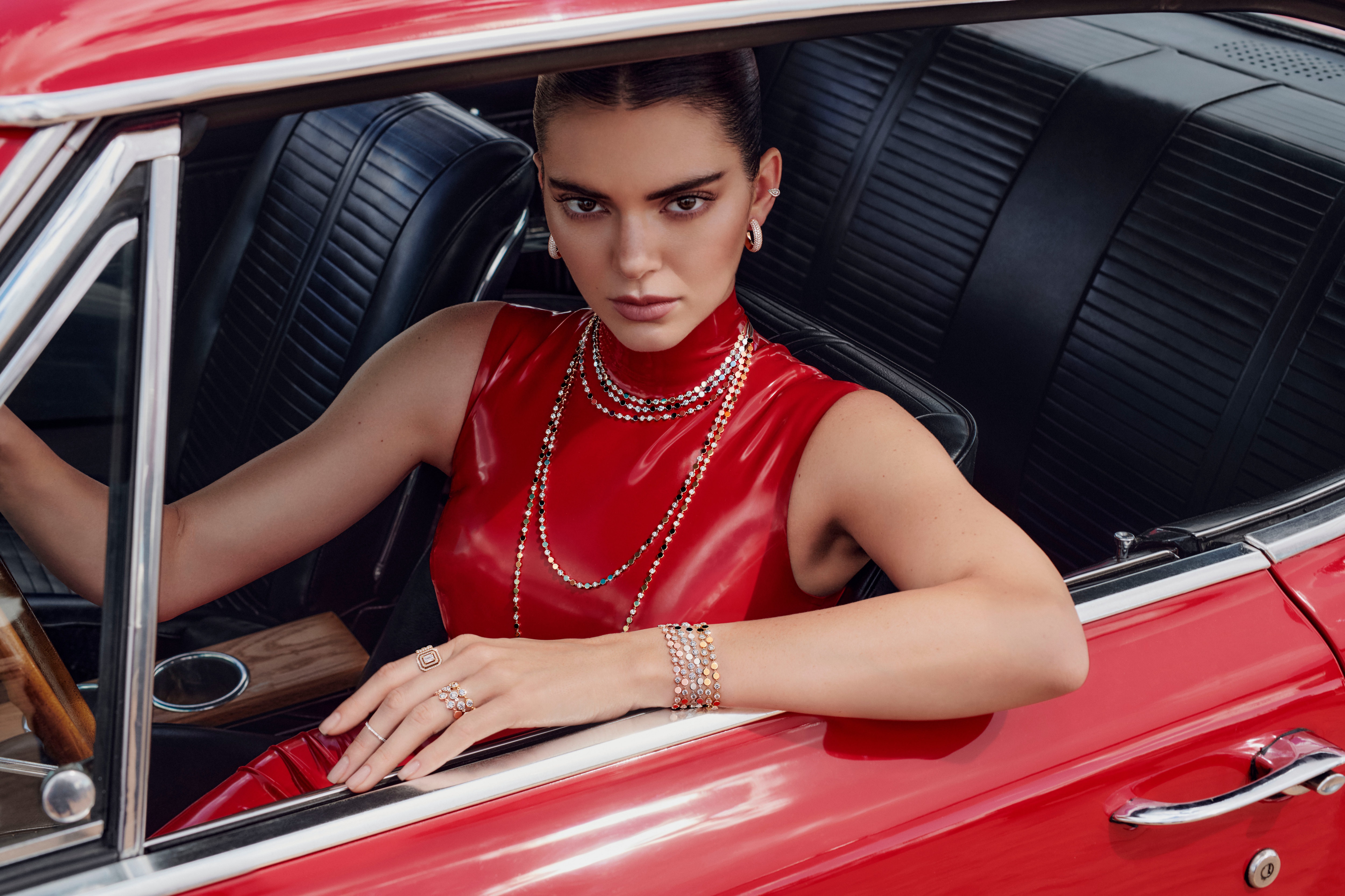 Kendall Jenner in a red dress in a car HD Wallpaper