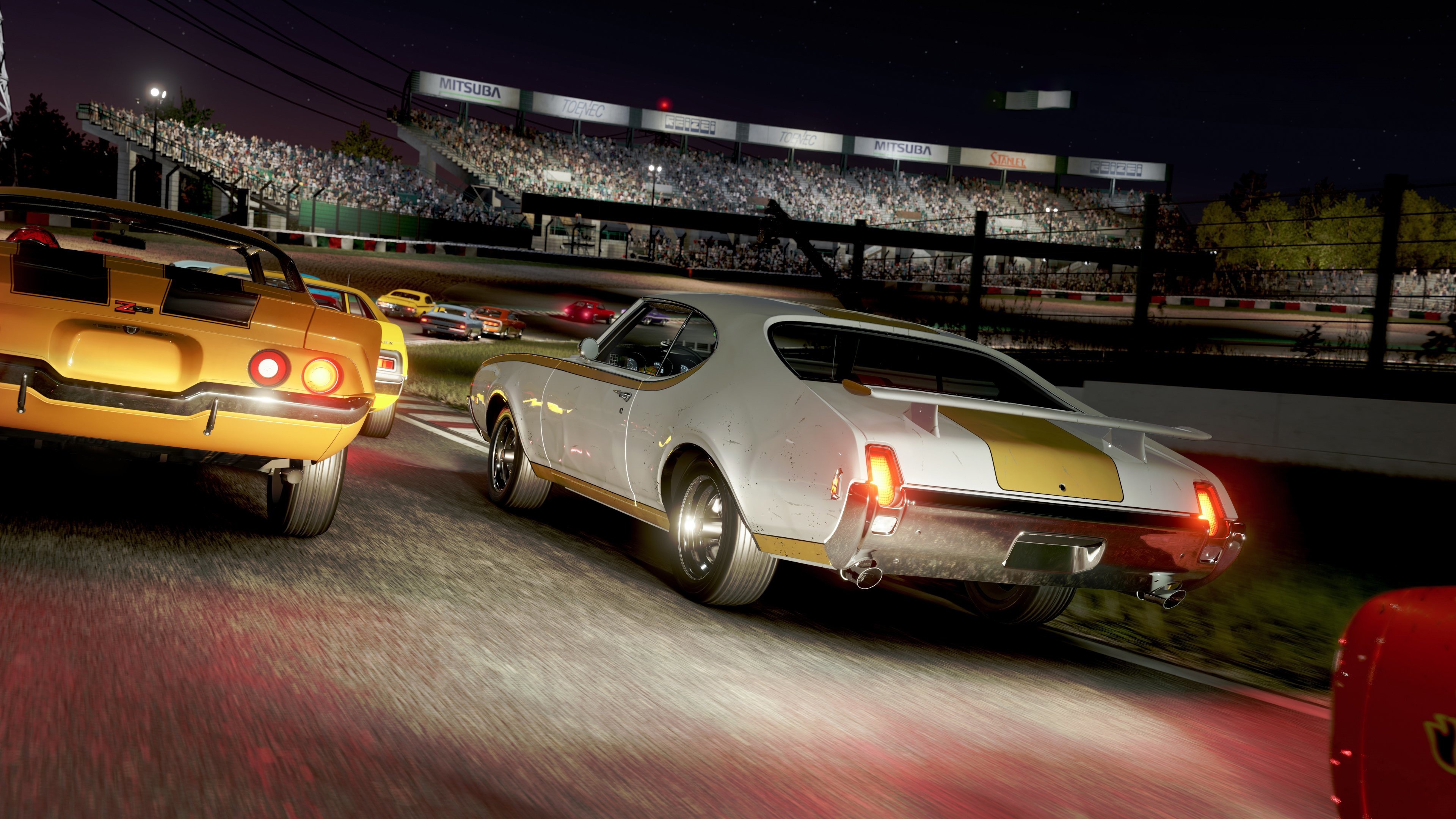 Cars racing at night in Forza Motorsport 4K HD Wallpaper