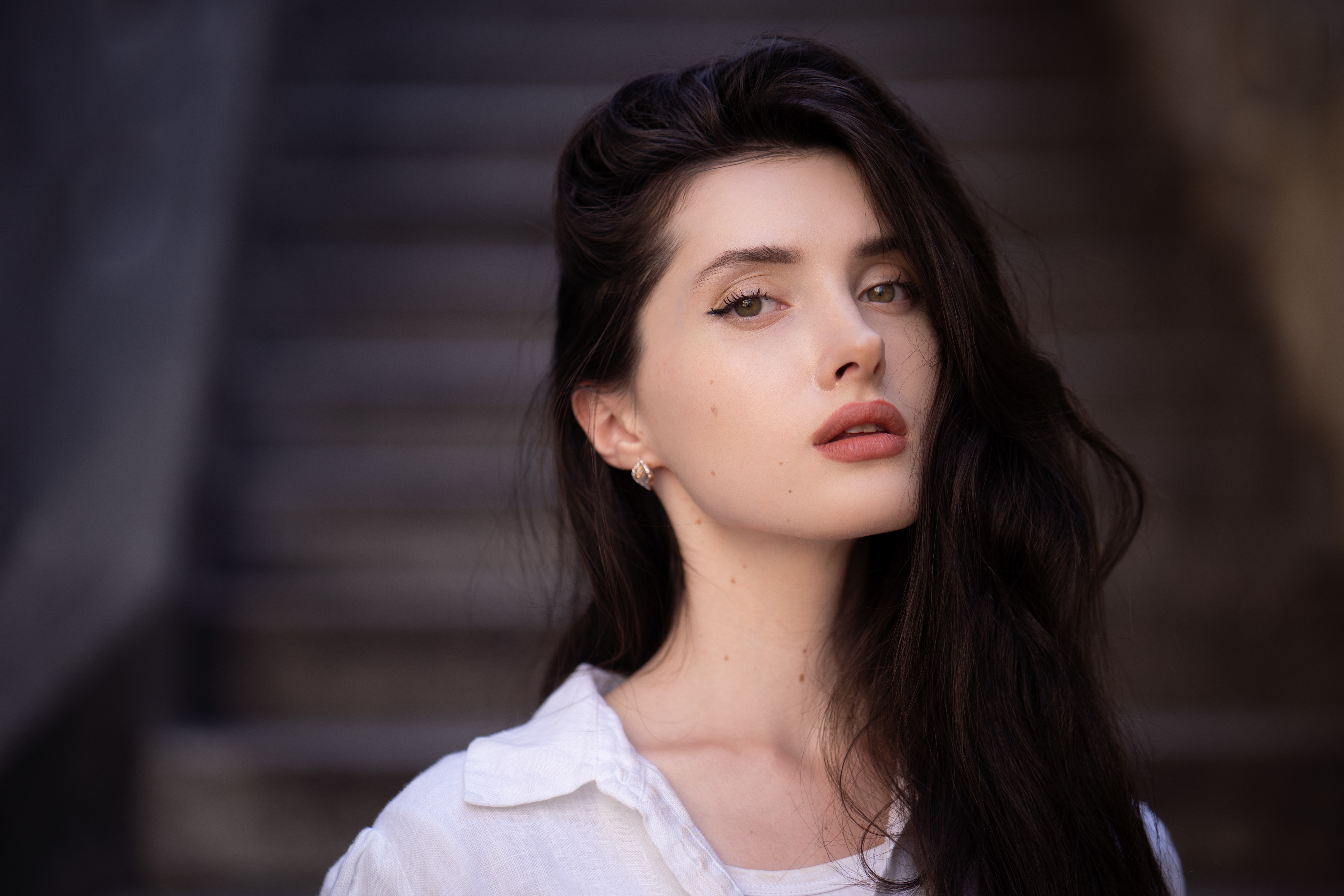 Young woman with dark hair and makeup HD Wallpaper