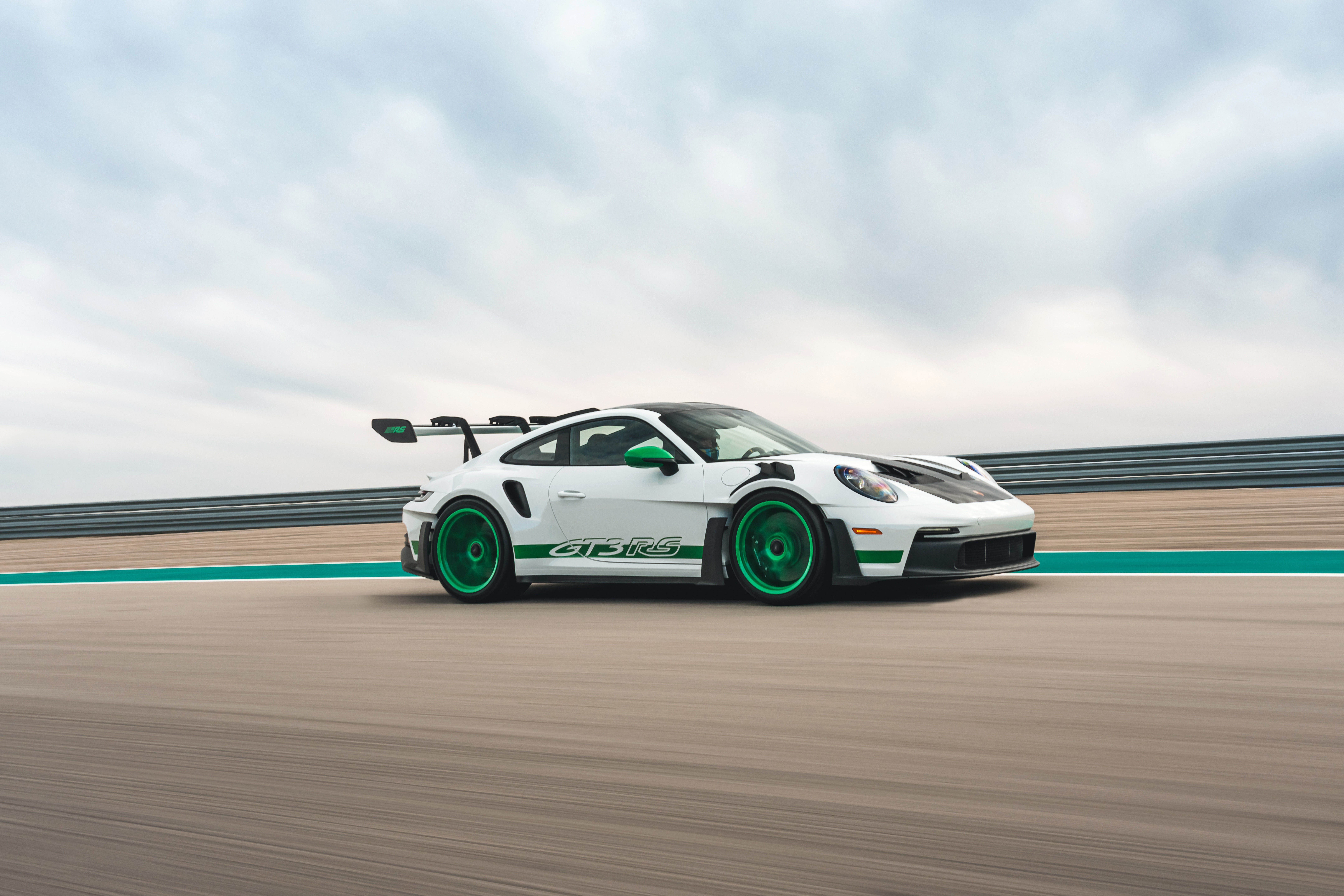 White Porsche 911 GT3 RS on a race track HD Wallpaper