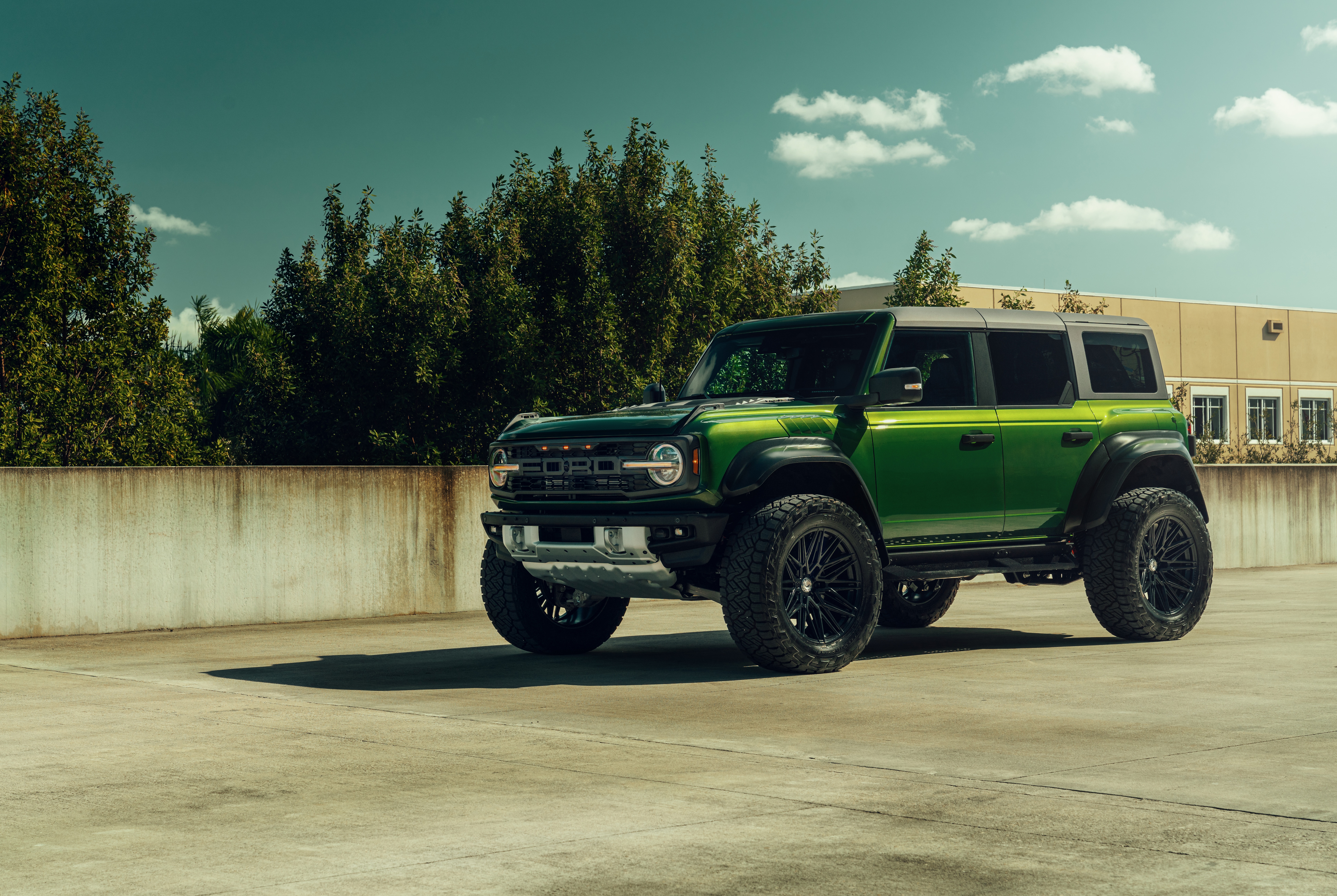Green Ford Bronco Raptor parked outdoors HD Wallpaper