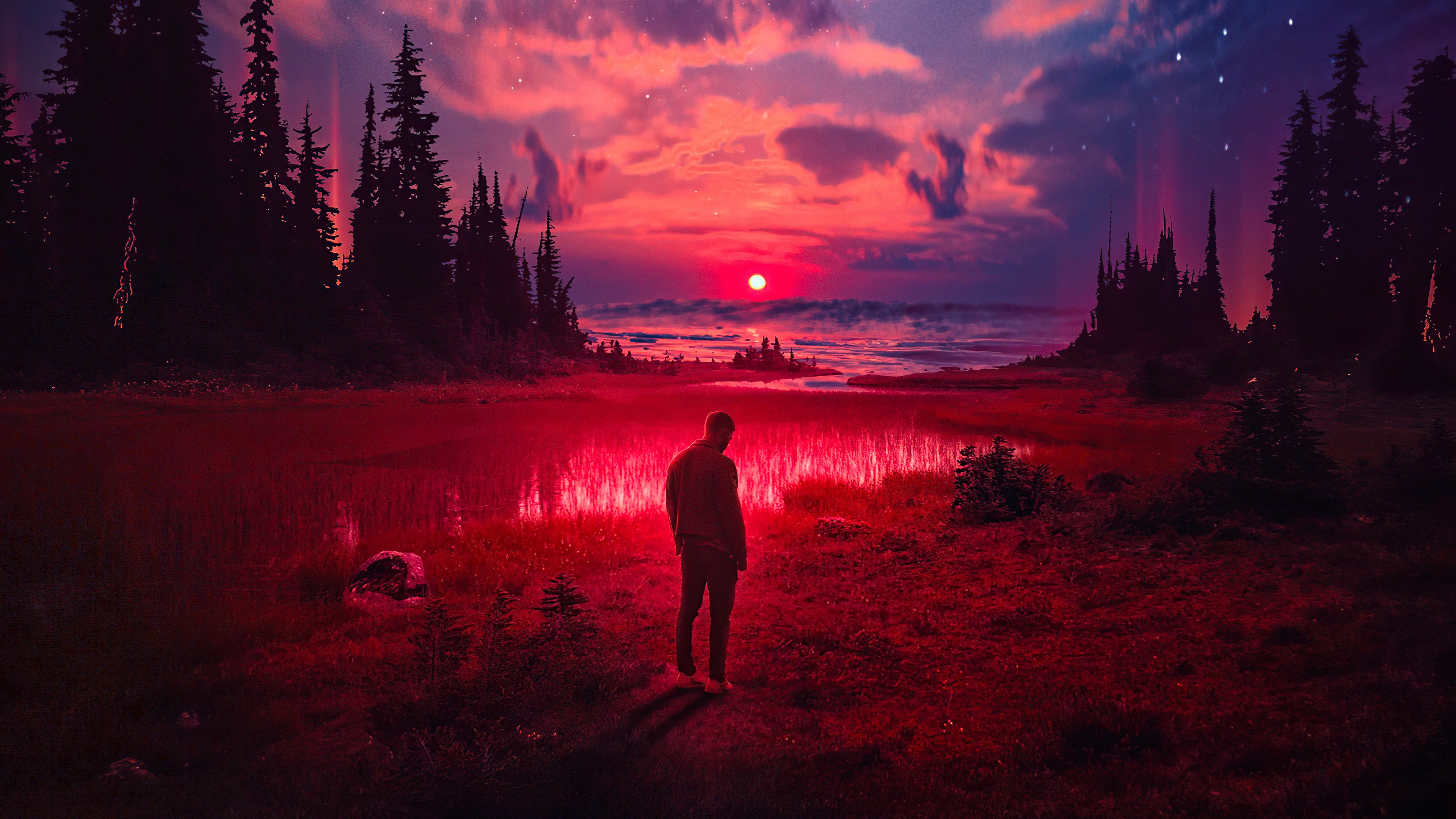 Man standing in a red landscape with a sunset HD Wallpaper