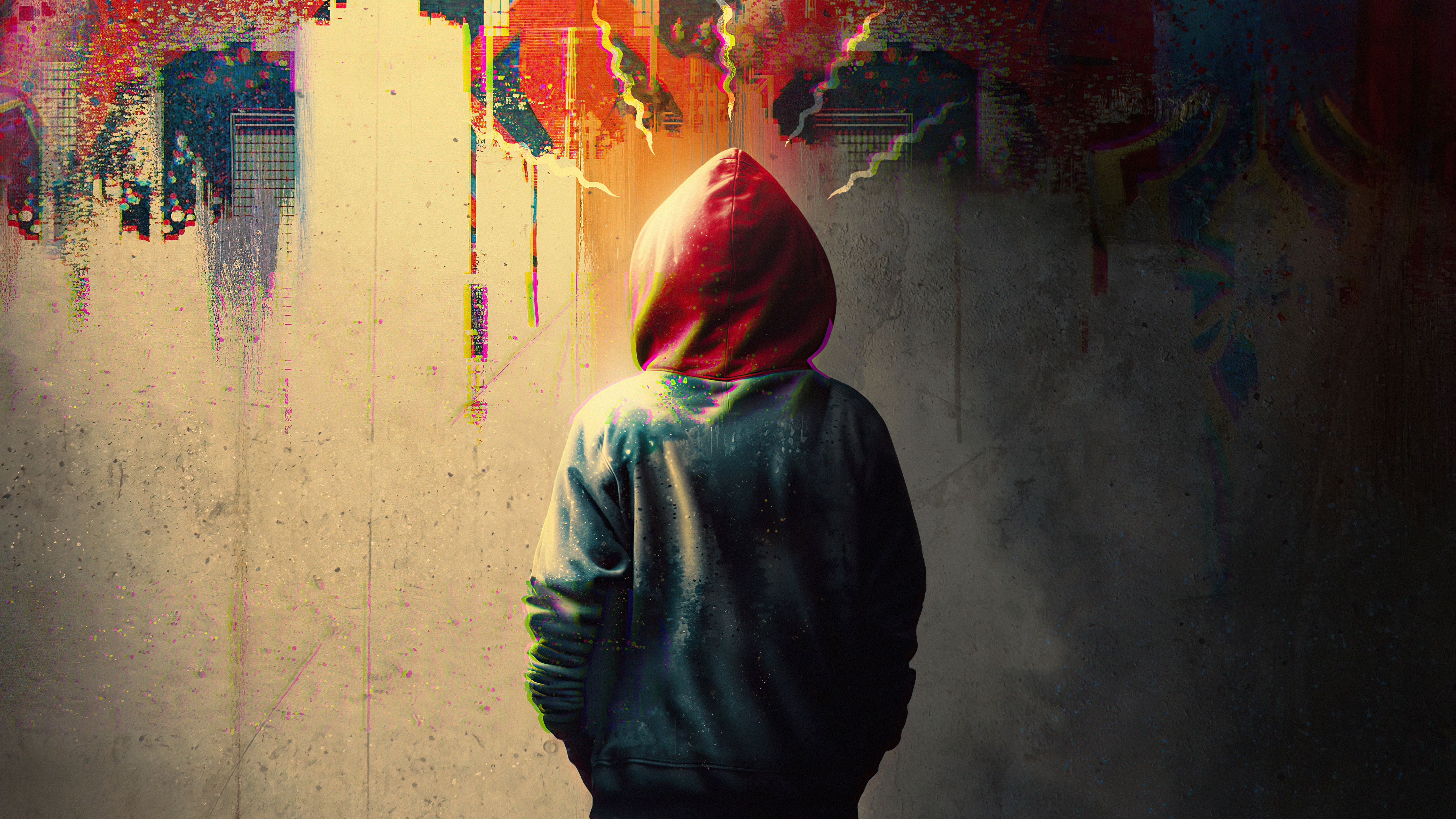 Person in hoodie with red hood against abstract graffiti wall HD Wallpaper