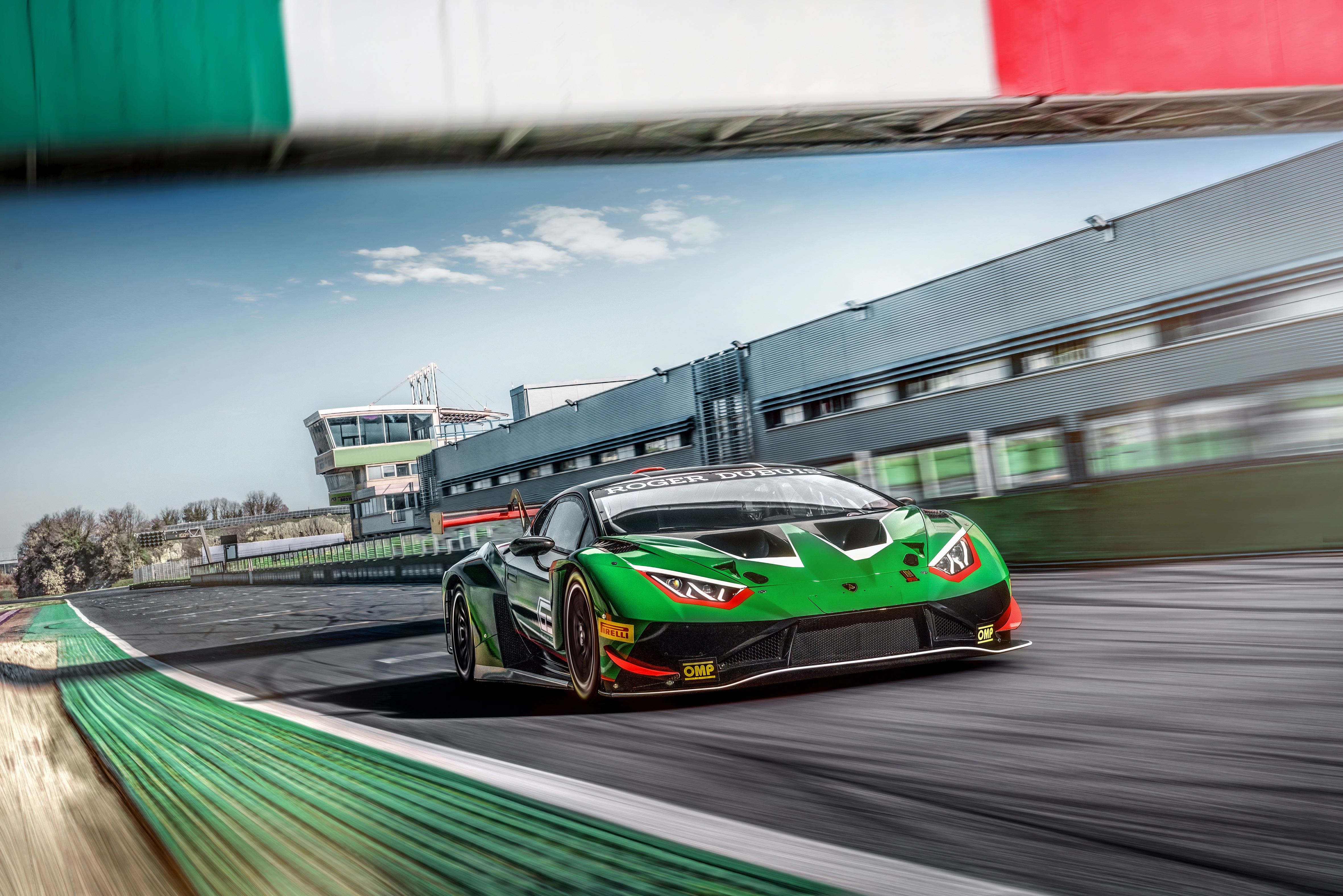 Green Lamborghini Huracan GT3 EVO on a race track HD Wallpaper