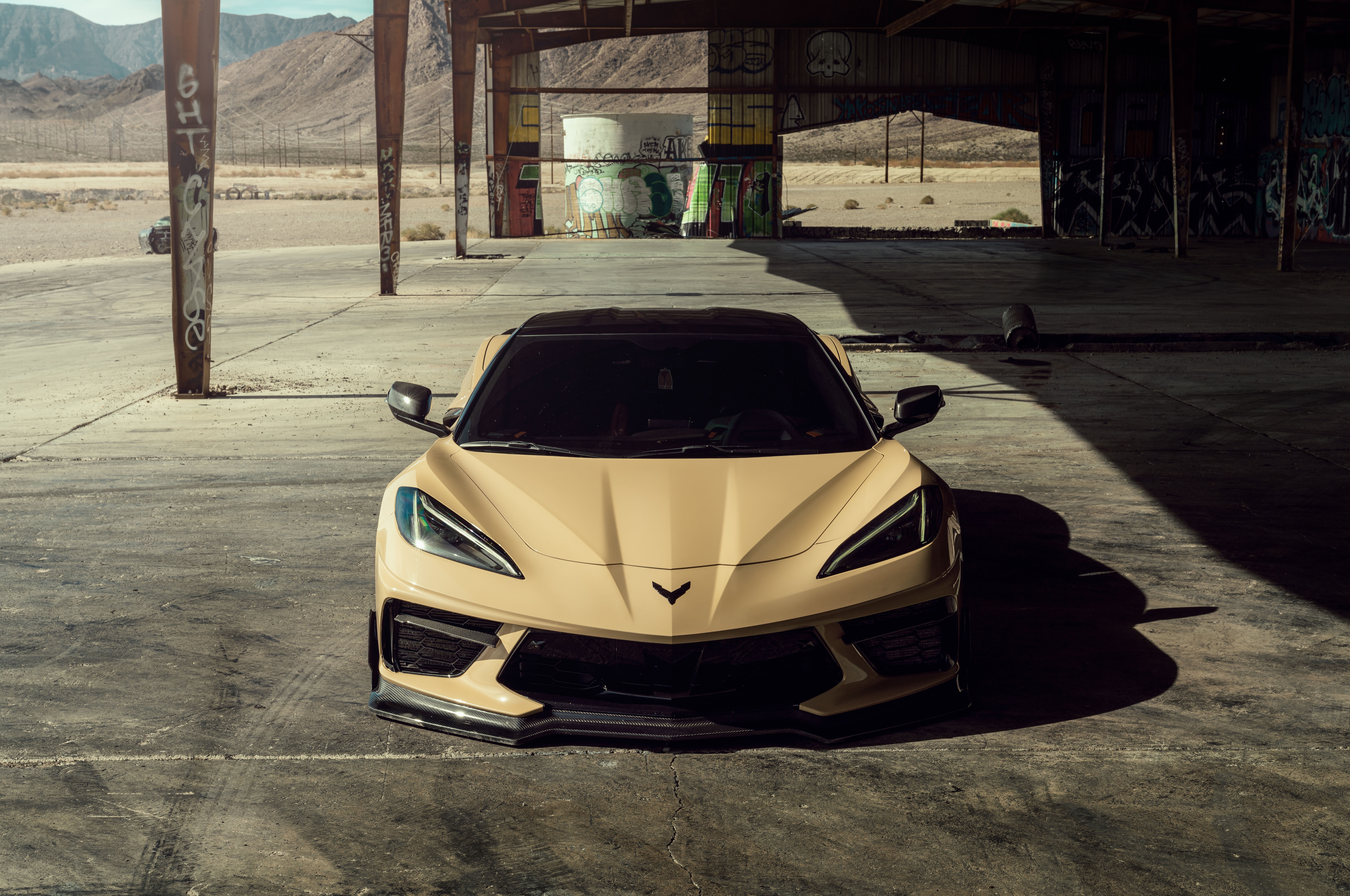 Tan Chevrolet Corvette C8 in abandoned building HD Wallpaper
