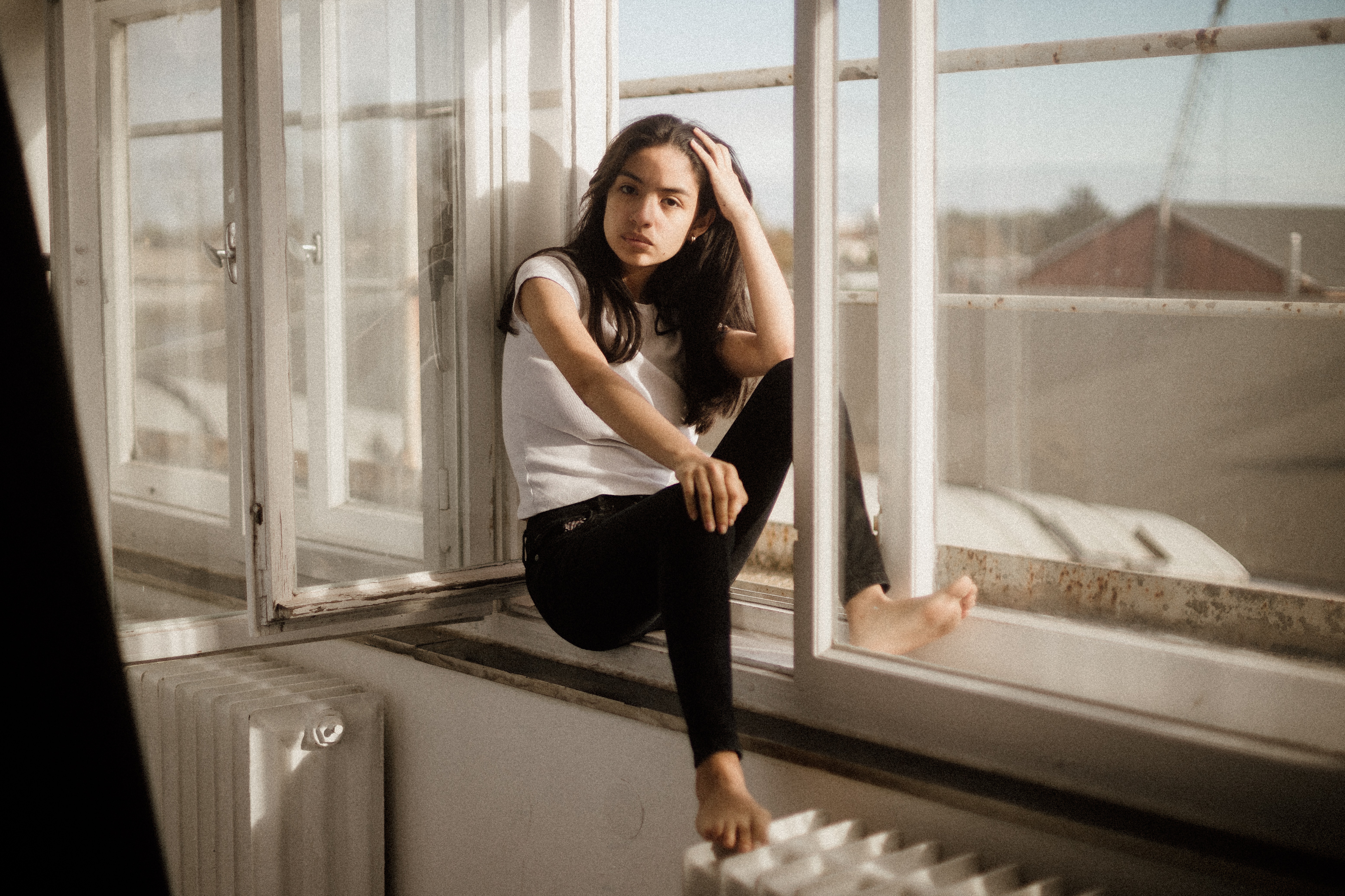 Girl sitting on a windowsill HD Wallpaper