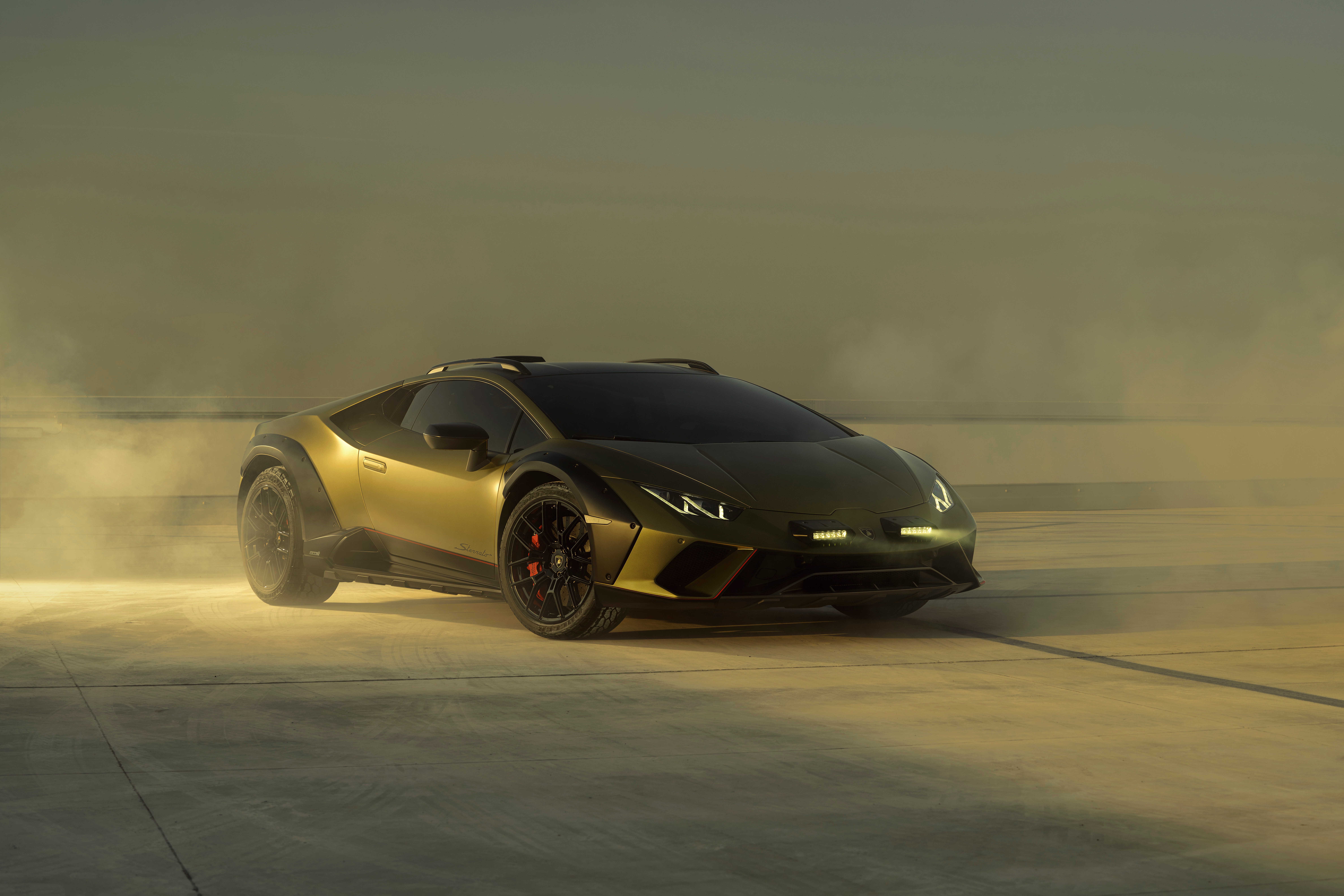 Lamborghini Huracan Sterrato in a dusty environment HD Wallpaper